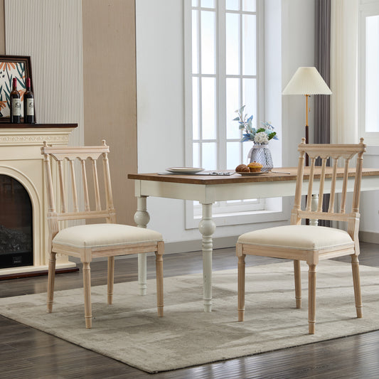 Light wood dining chair with upholstered cream seat and spindle back design