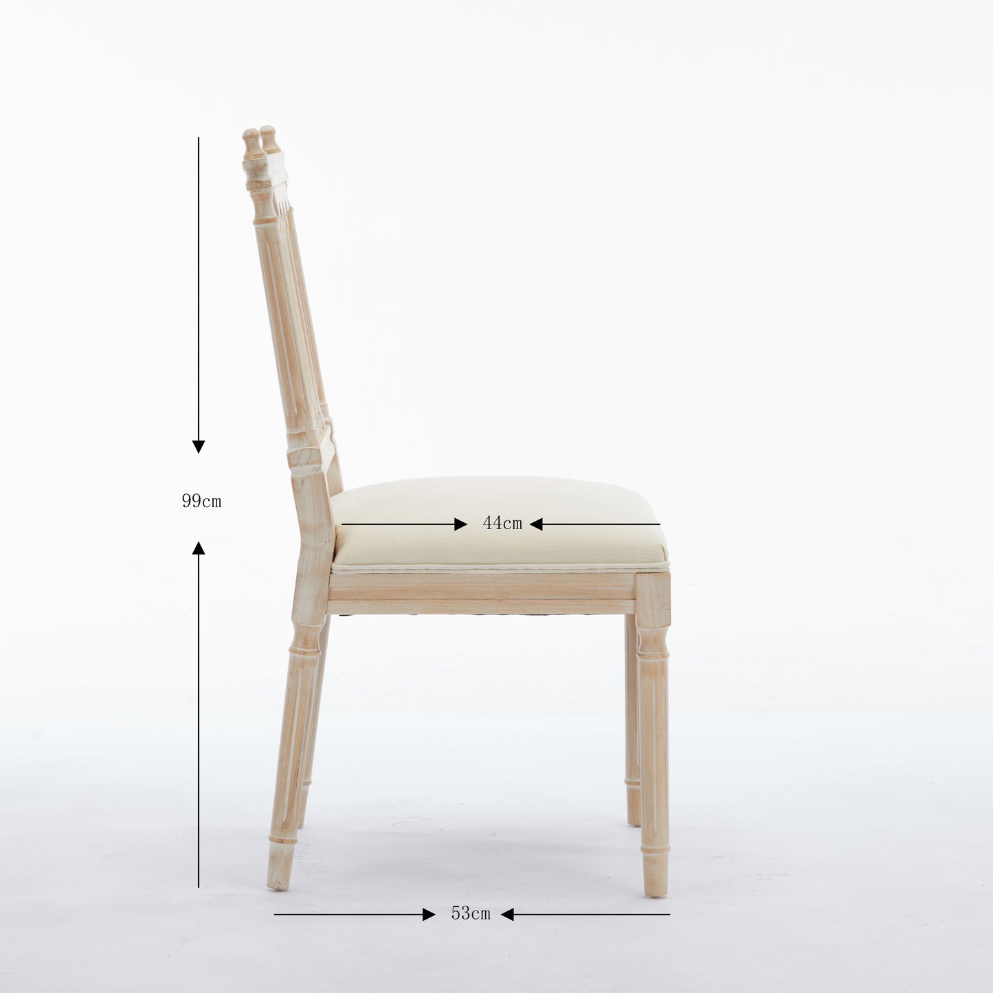 A light wood dining chair with a cream upholstered seat and ornate detailing on the back and legs