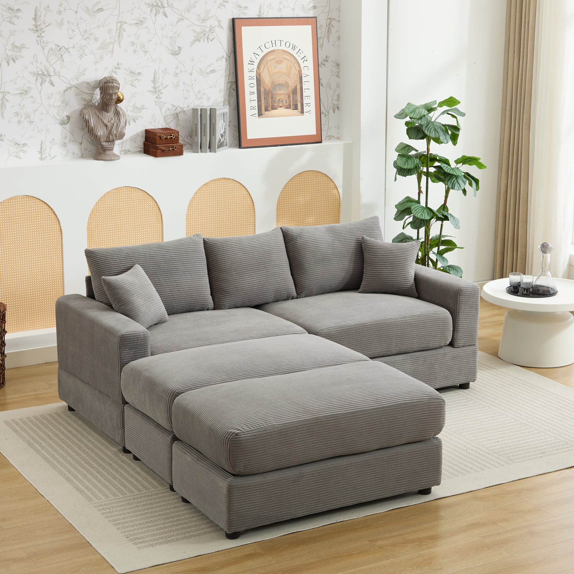 Gray corduroy sectional sofa with plush cushions and an ottoman perfect for modern living rooms