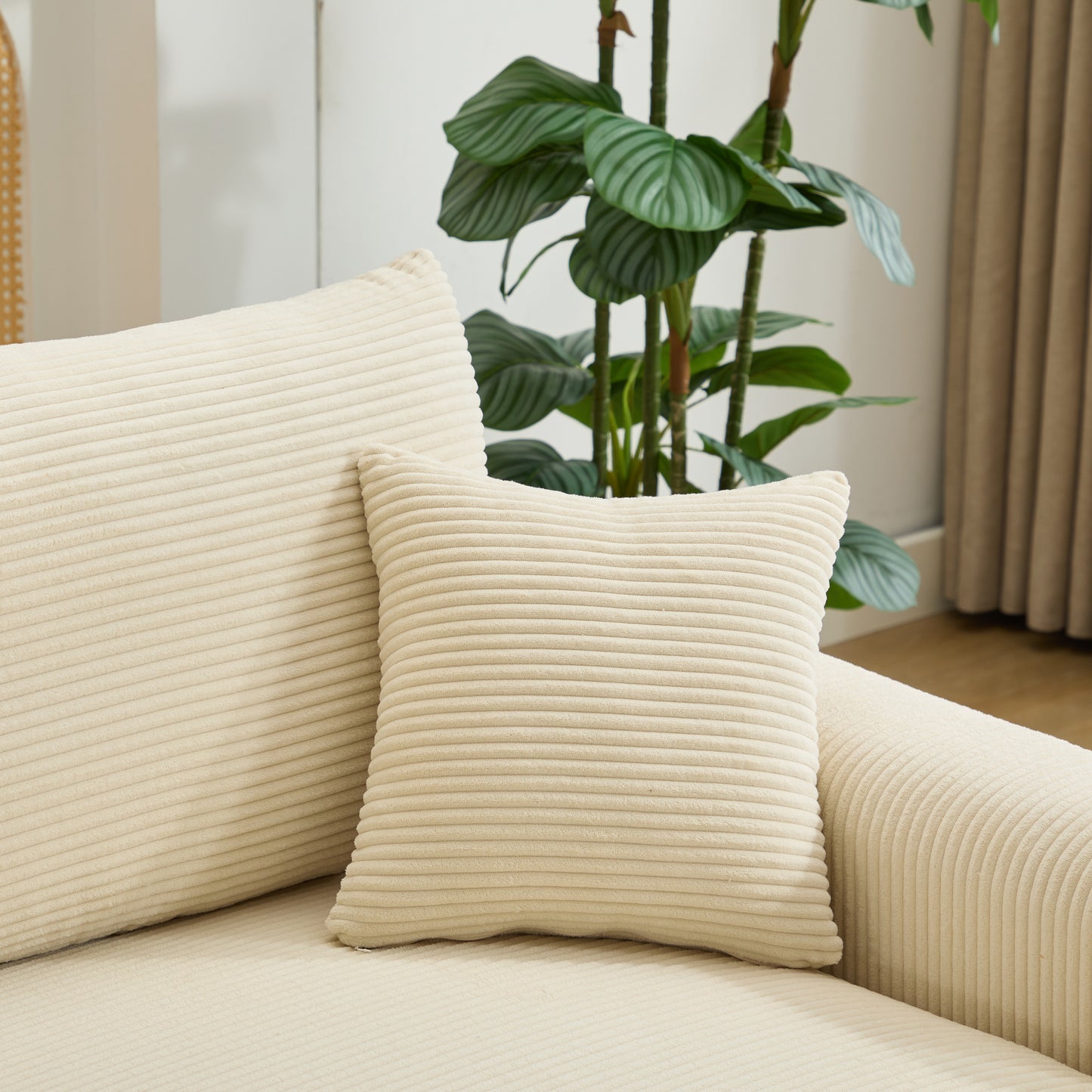 Plush cream corduroy sofa cushion with horizontal ribbing detail