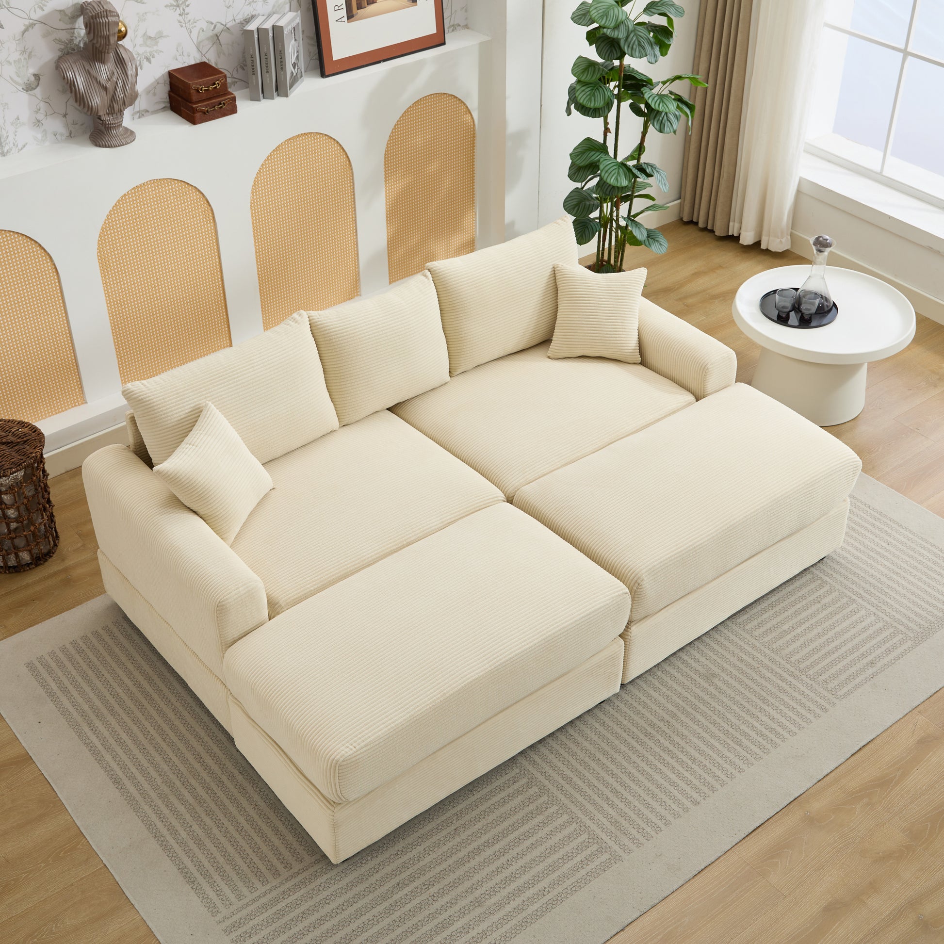 Cream corduroy sectional sofa with plush throw pillows modern living room furniture