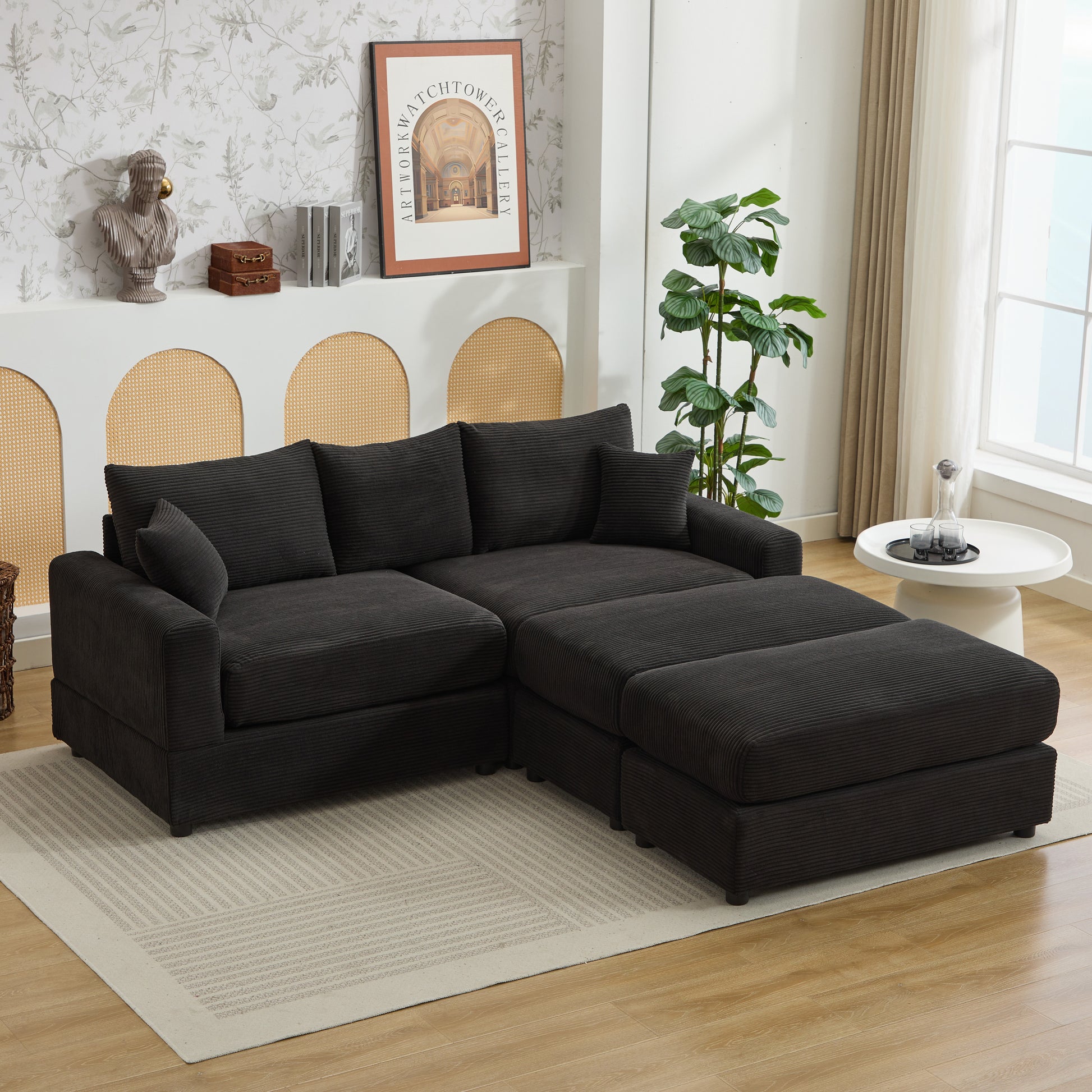 Dark grey corduroy sectional sofa with plush cushions and matching ottomans
