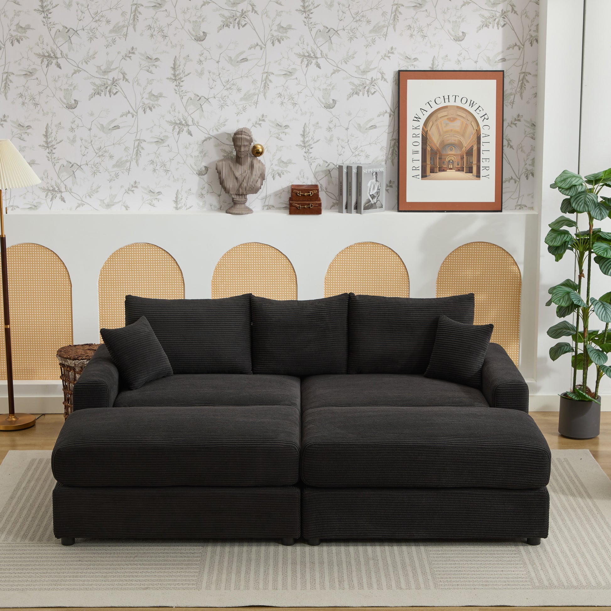 Dark charcoal corduroy sectional sofa with plush cushions and an ottoman