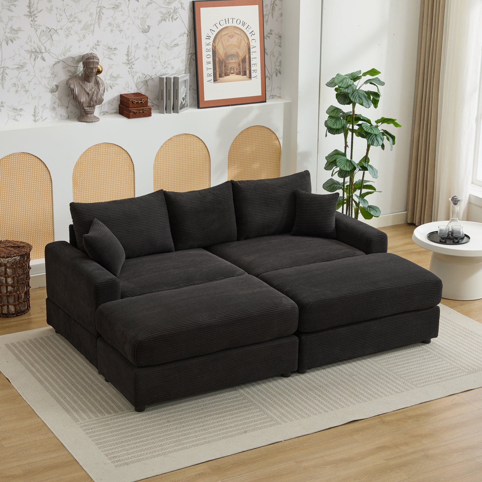 Dark charcoal corduroy sectional sofa with multiple chaise sections and plush cushions