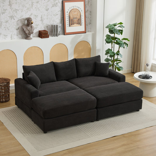 Dark charcoal corduroy sectional sofa with multiple chaise sections and plush cushions