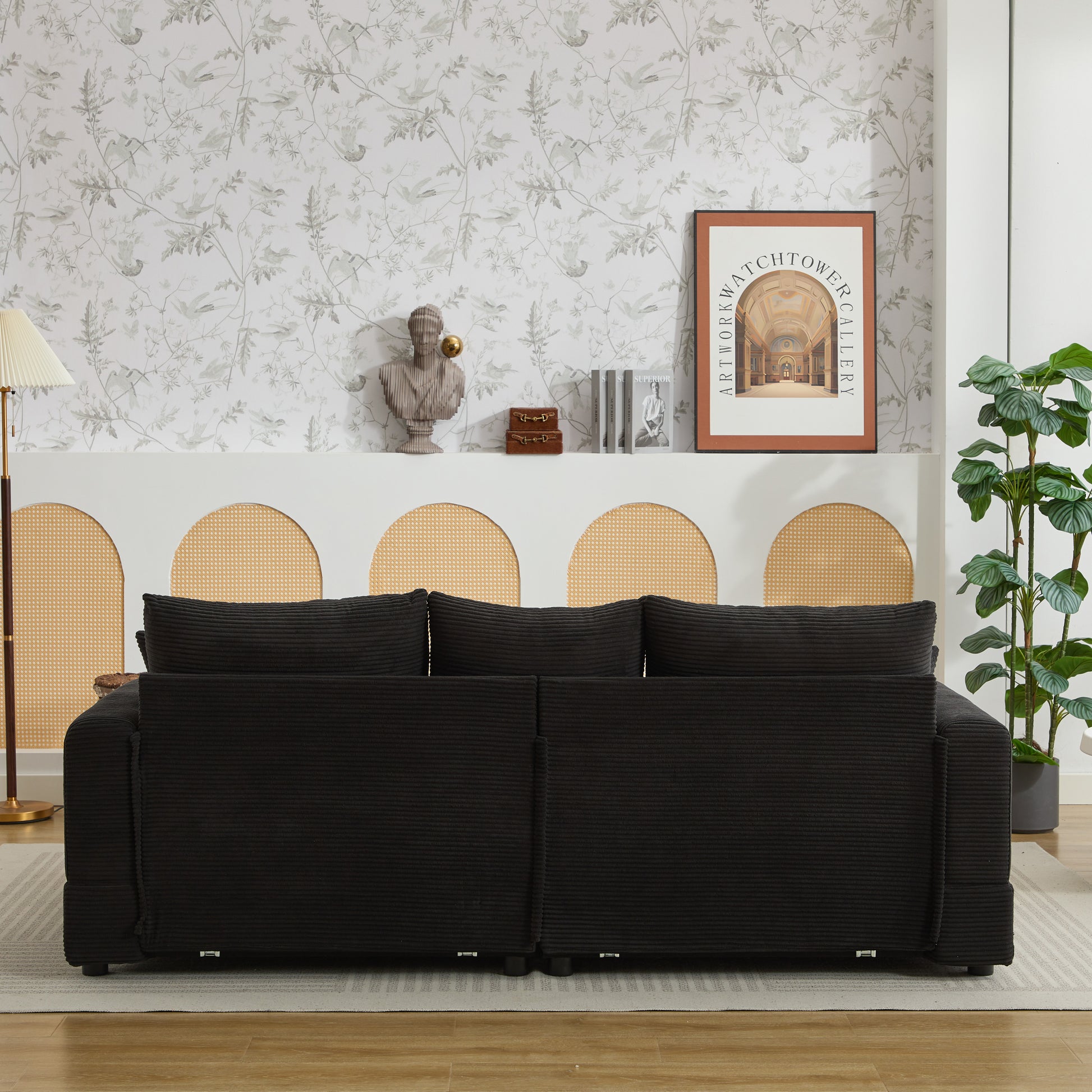 Black corduroy sofa with plush cushions for comfortable living room seating