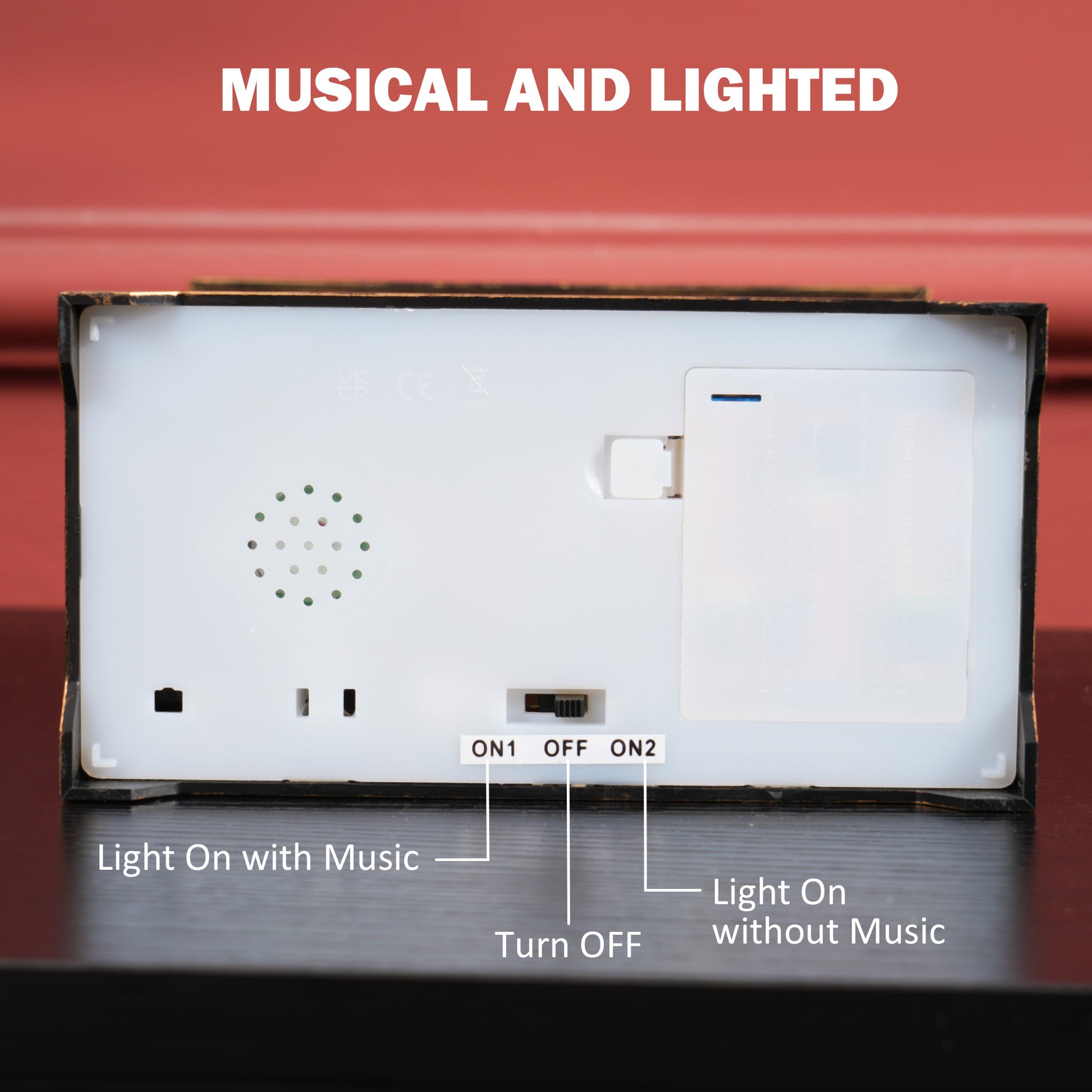 Back view of a white musical and lighted decoration with ON OFF ON switches