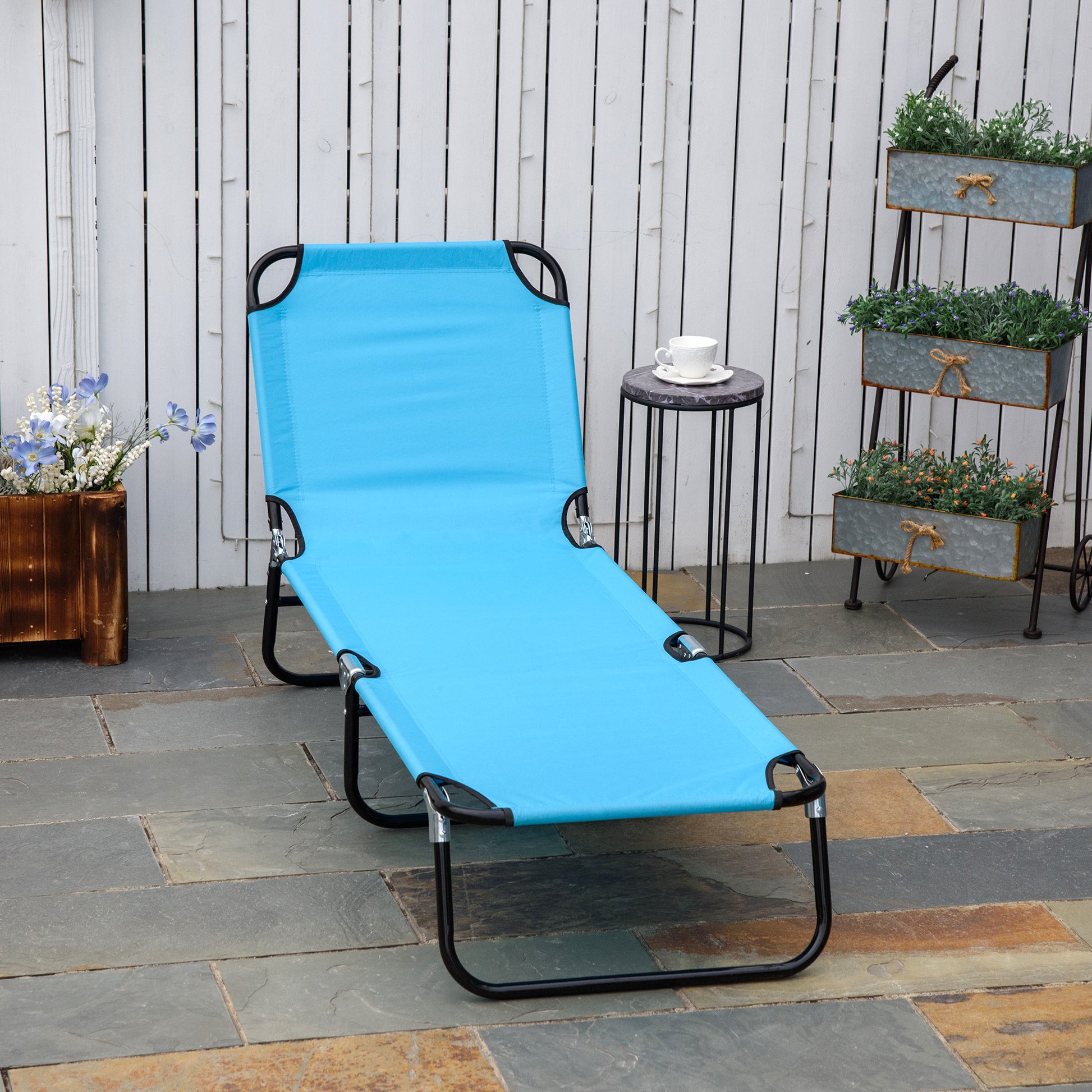 Blue fabric chaise lounge with black metal frame ideal for patio relaxation