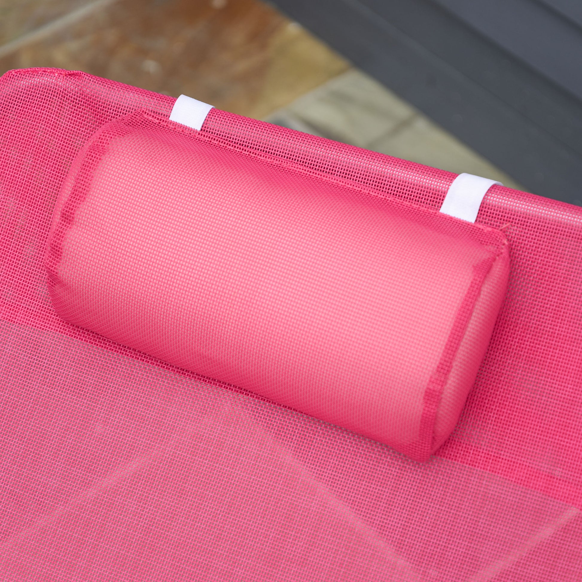 Pink mesh recliner pillow with white strap