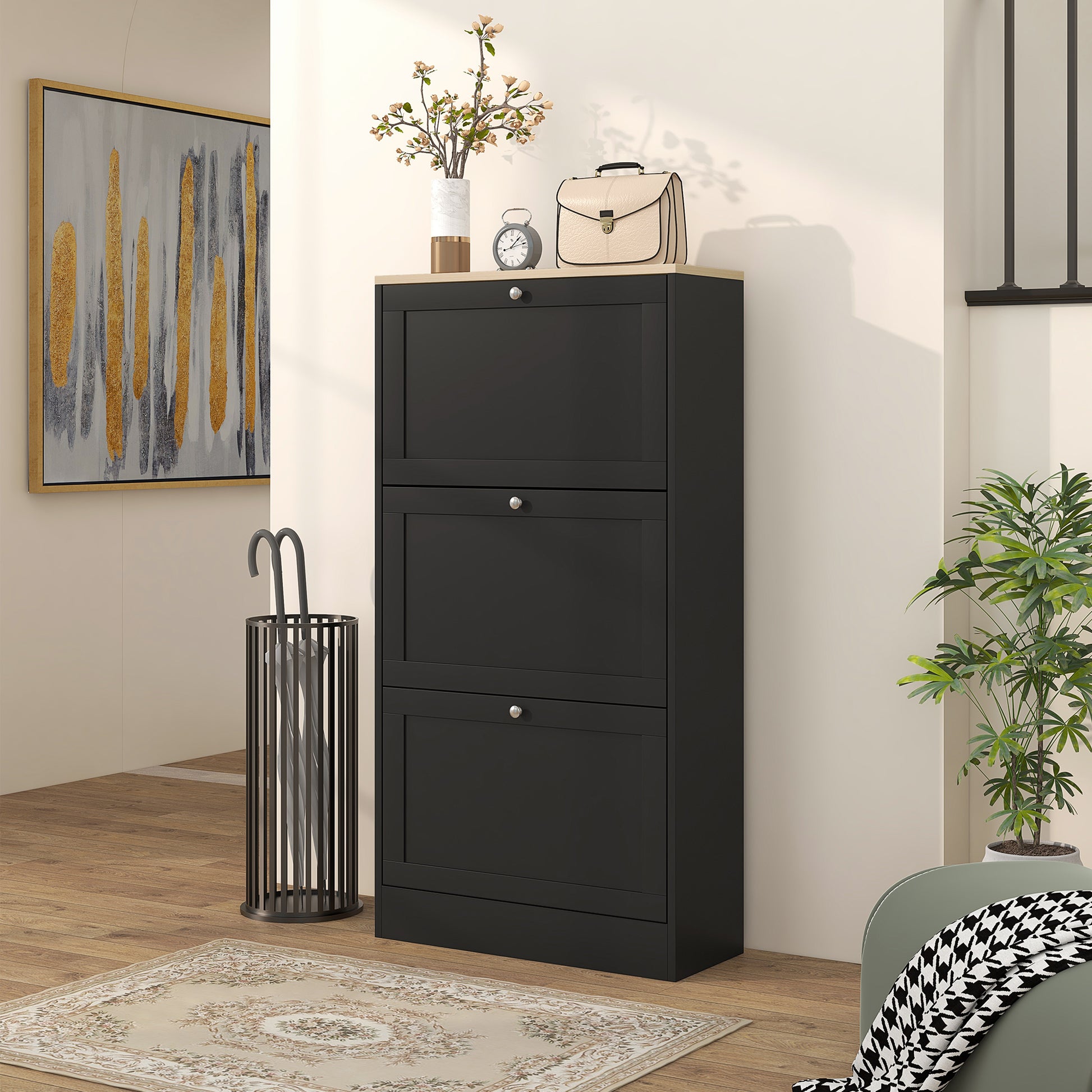 Black threetier narrow shoe cabinet with silver knobs and woodeffect top