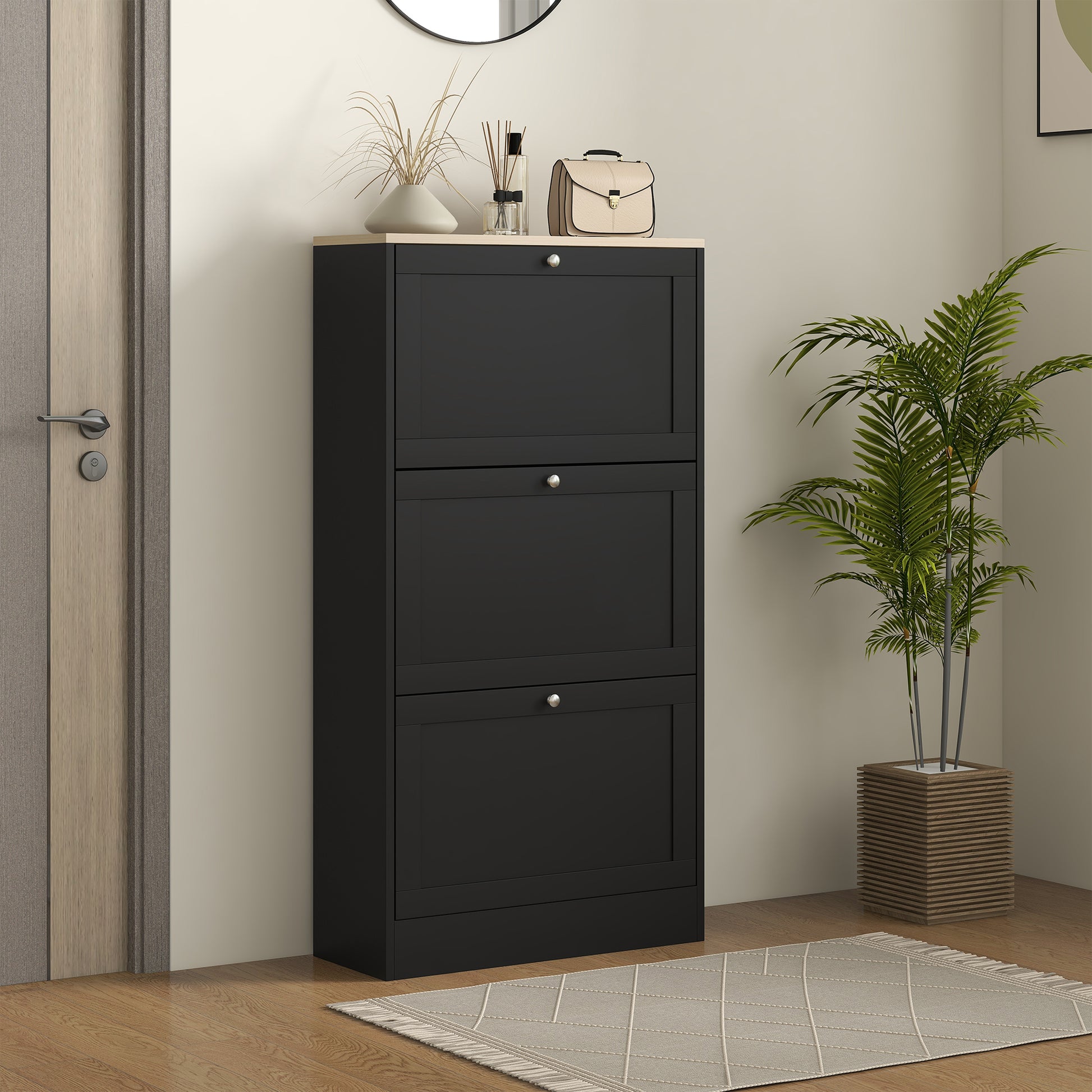 Black threedoor narrow shoe cabinet with silver knobs and light wood top