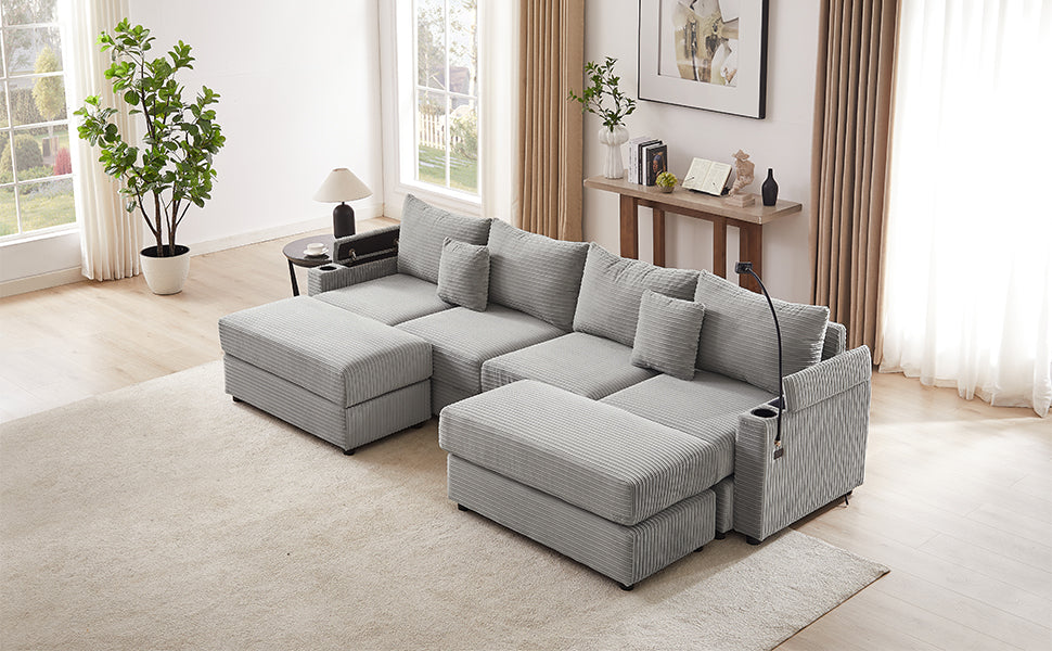 Gray corduroy sectional sofa with modular chaise and ottoman perfect for modern living rooms