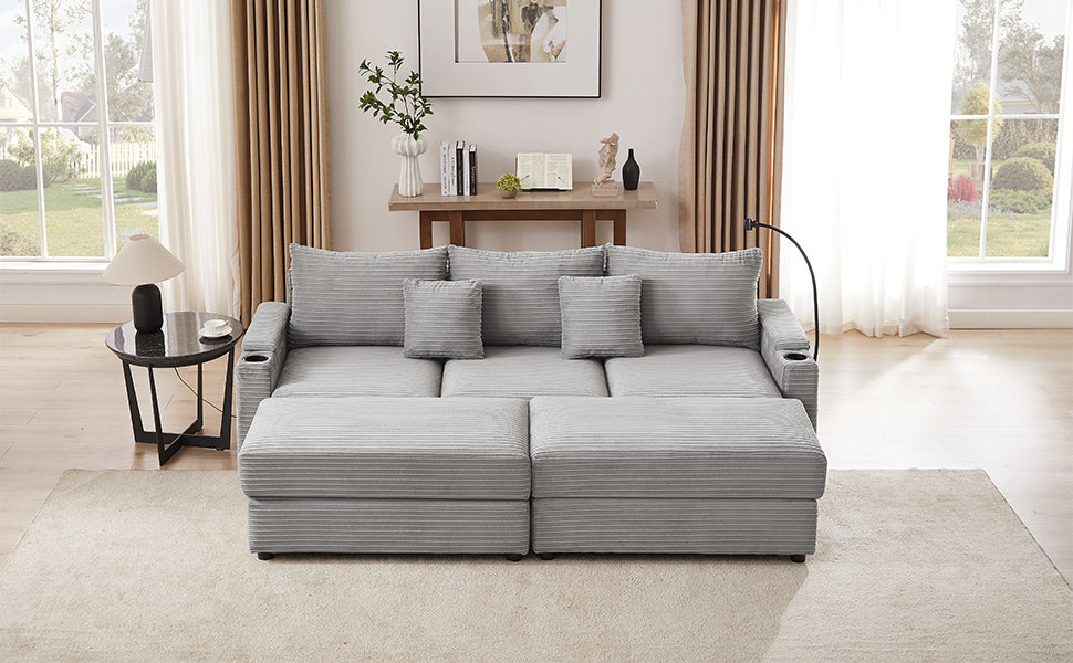 Light gray corduroy sectional sofa with plush cushions and integrated cup holders
