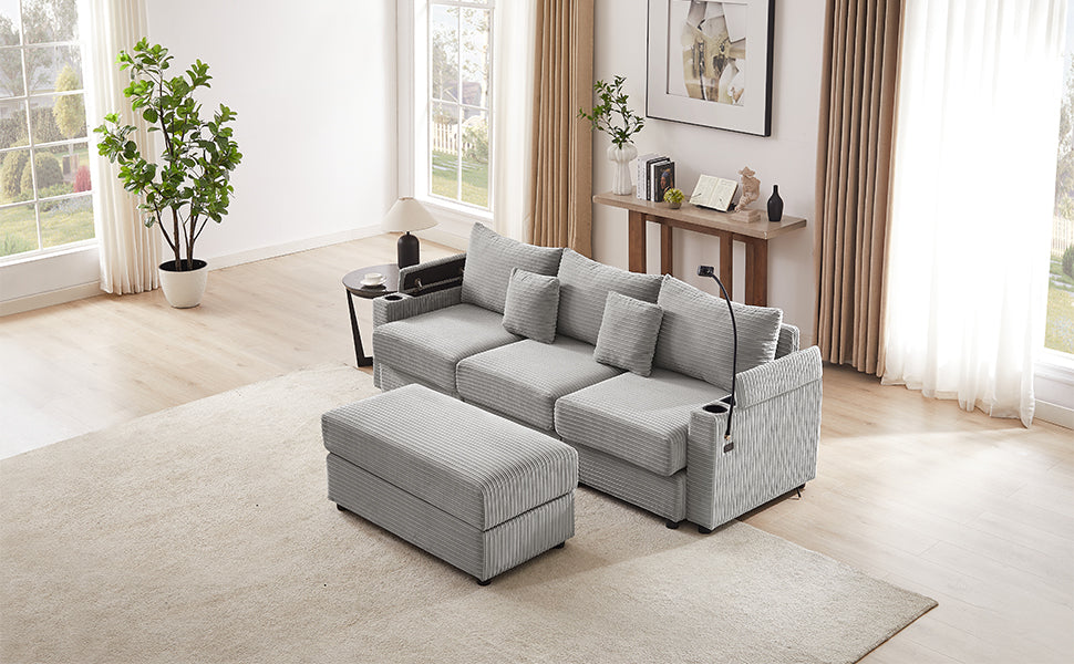 Light grey corduroy sectional sofa with matching ottoman and builtin cup holders