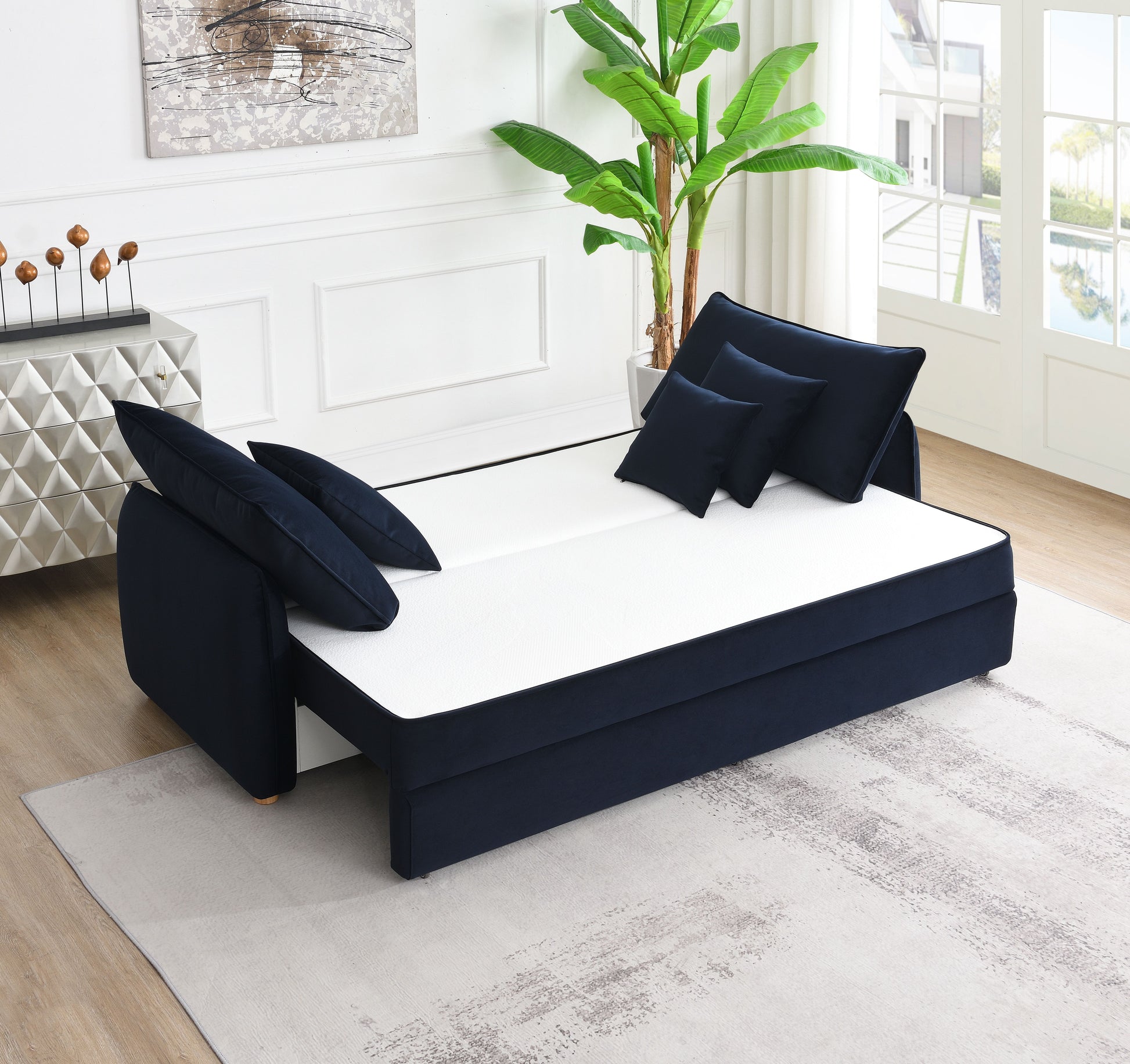 Dark navy velvet sofa bed with white mattress and matching pillows modern living room furniture