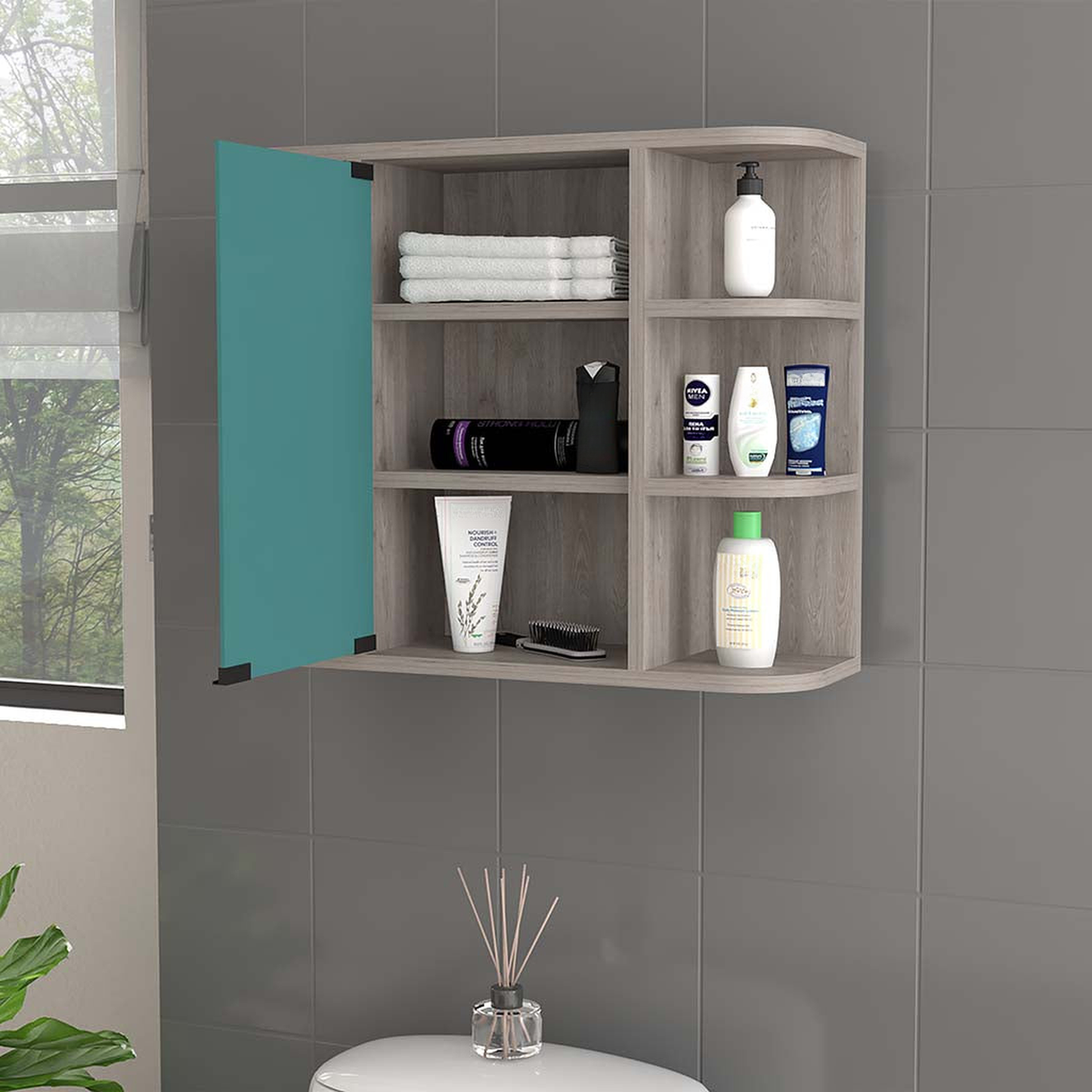 Modern grey wood bathroom cabinet with teal door and shelves for toiletries