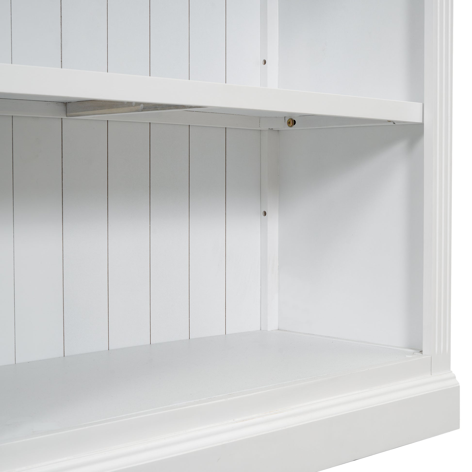 Closeup of white beadboard shelving unit interior showing clean lines and modern design