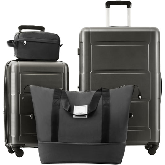 Dark grey hardshell luggage set including two suitcases a travel bag and a toiletry case