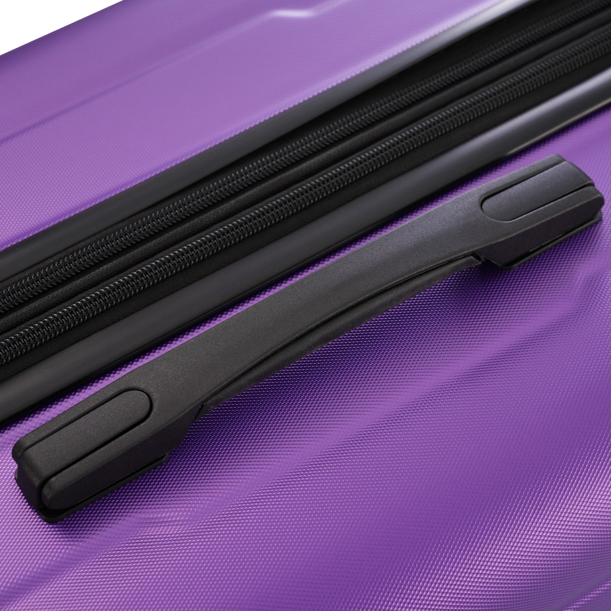 Purple hardshell luggage detail with black zipper and handle