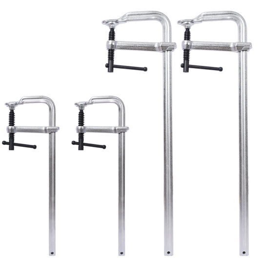 Set of four metallic C clamps in graduated sizes essential woodworking tools
