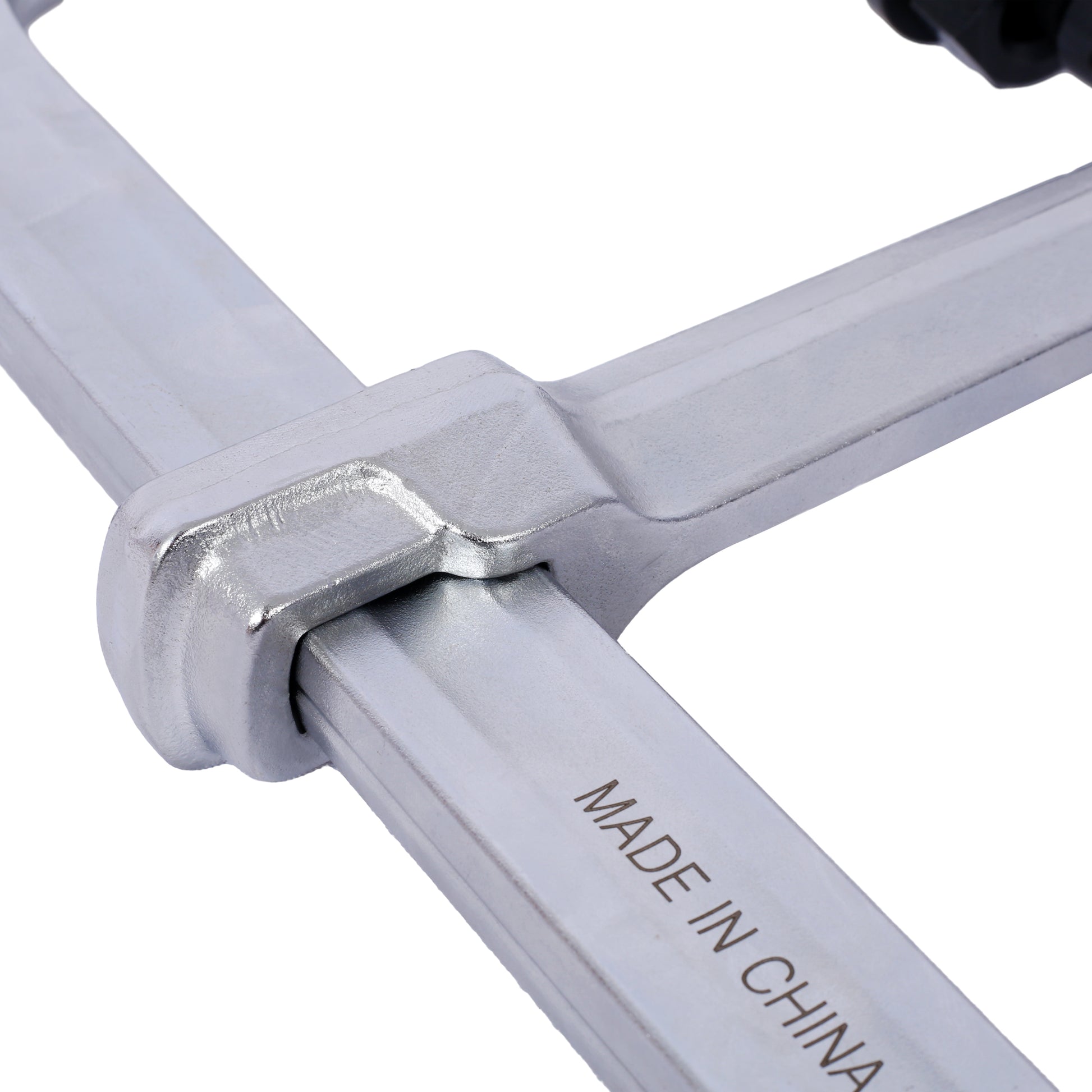 Close up of a metal F clamp featuring a quickrelease trigger for easy adjustment