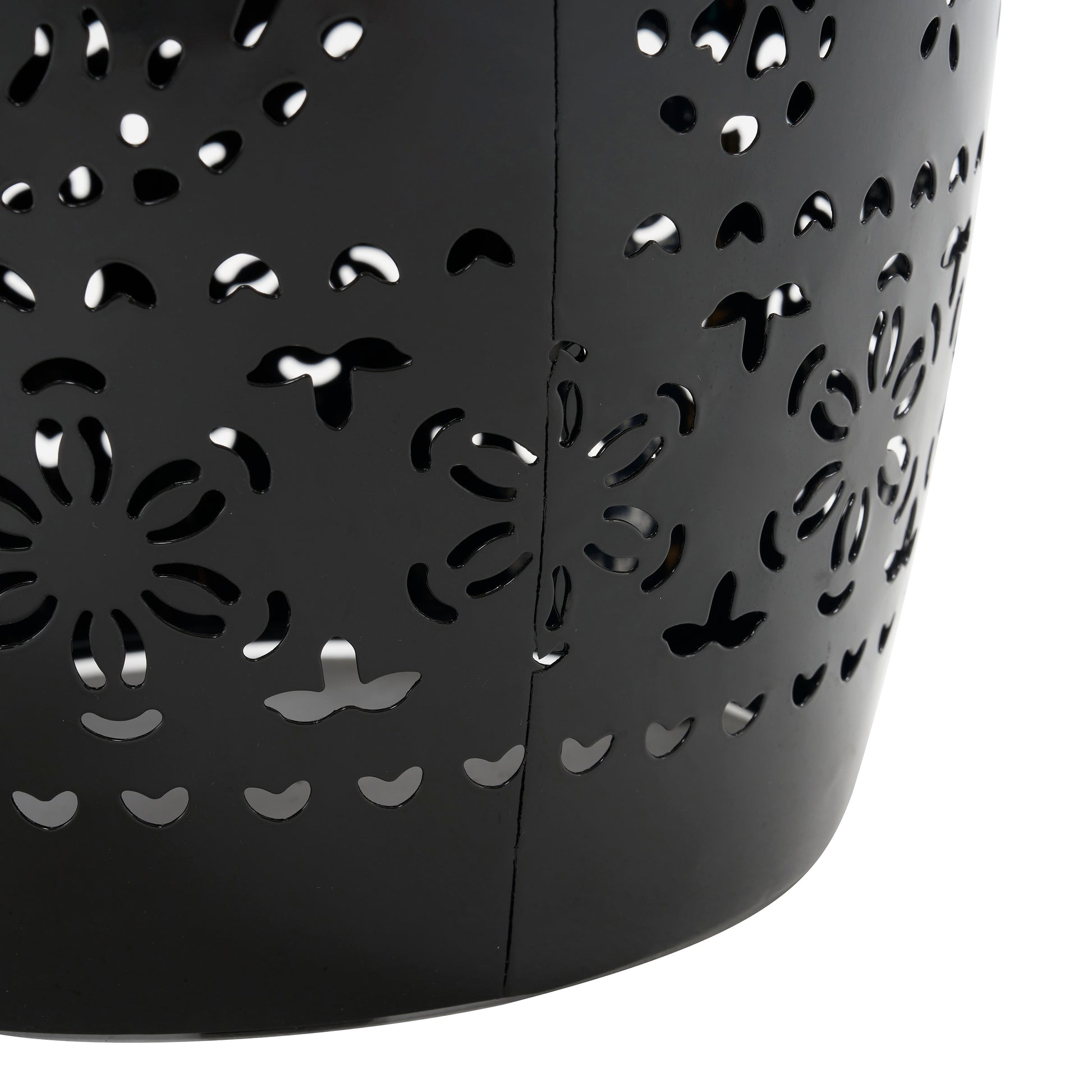 Black metal basket with intricate floral cutouts ideal for decorative storage