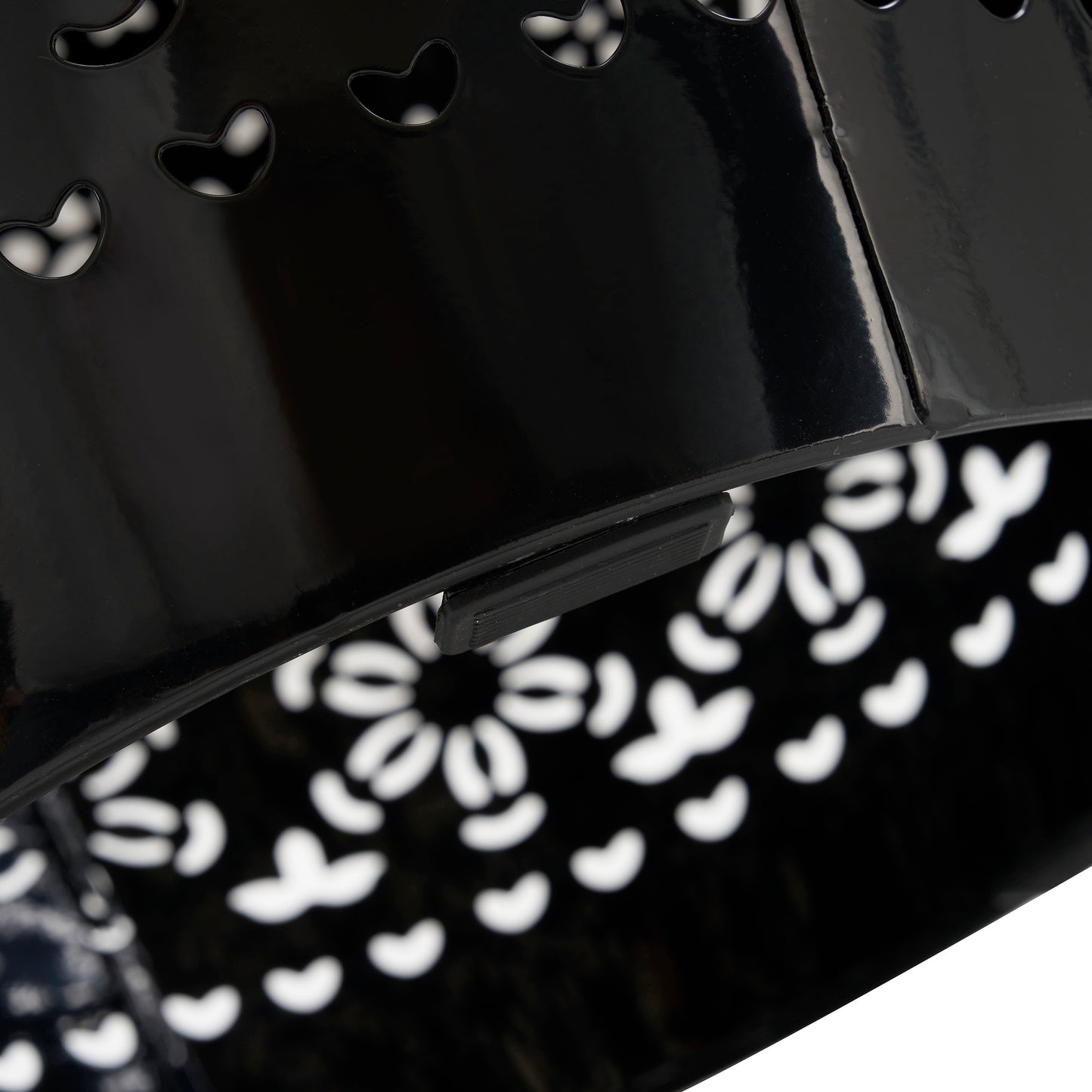 Black lacquered metal basket with heart cutouts and handle clip