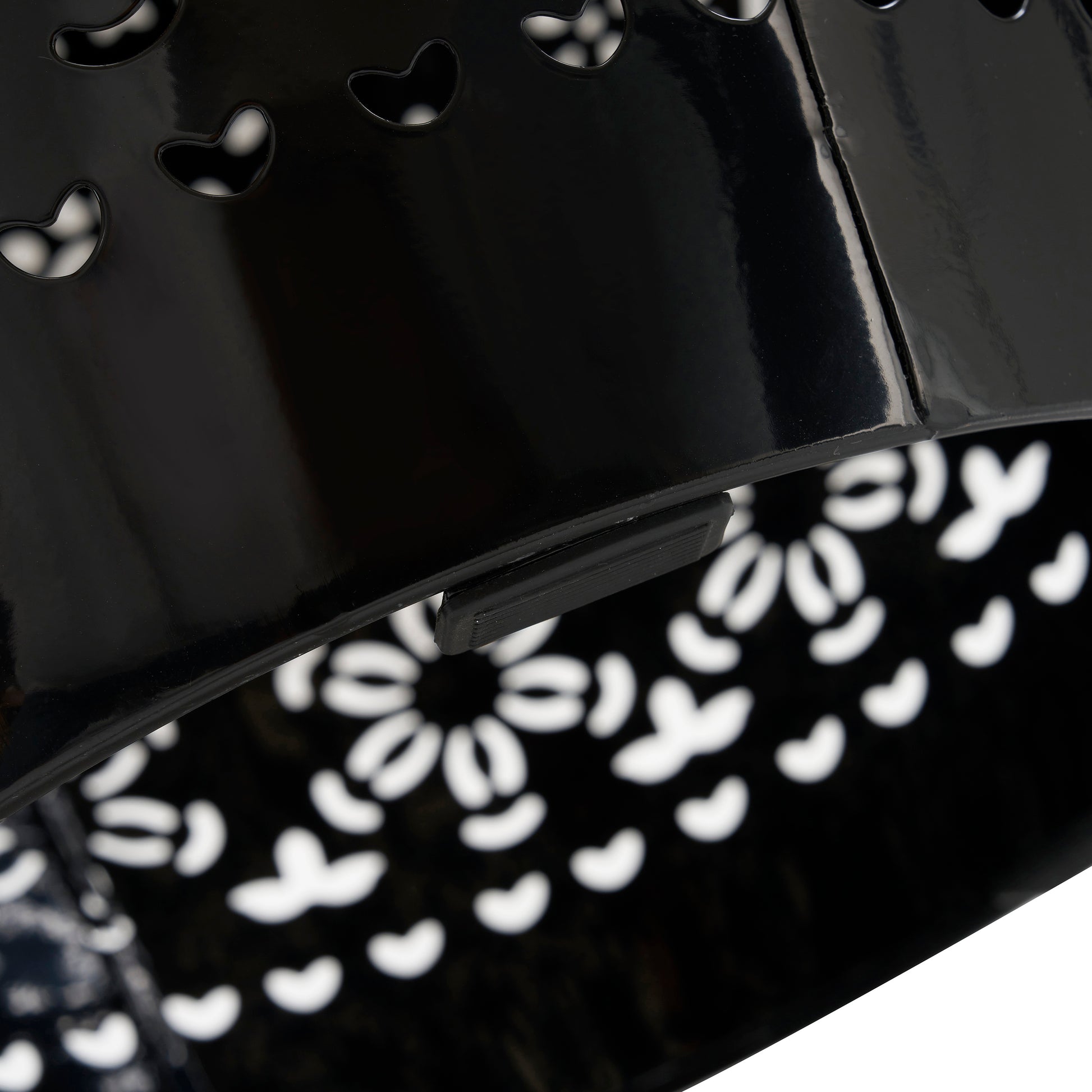 Black lacquered metal basket with heart cutouts and handle clip