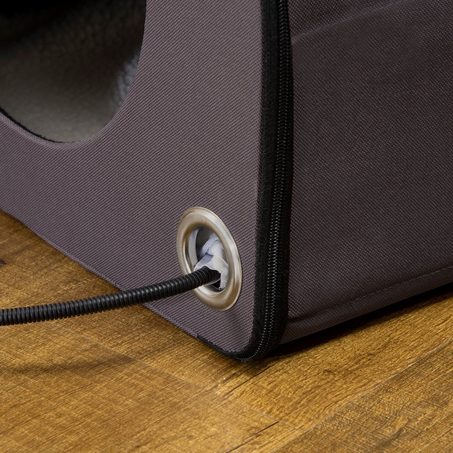 Gray fabric pet carrier with grommet and black cord detail