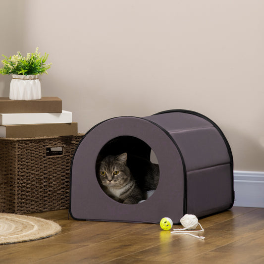 Gray fabric pet bed with round opening featuring a tabby cat inside
