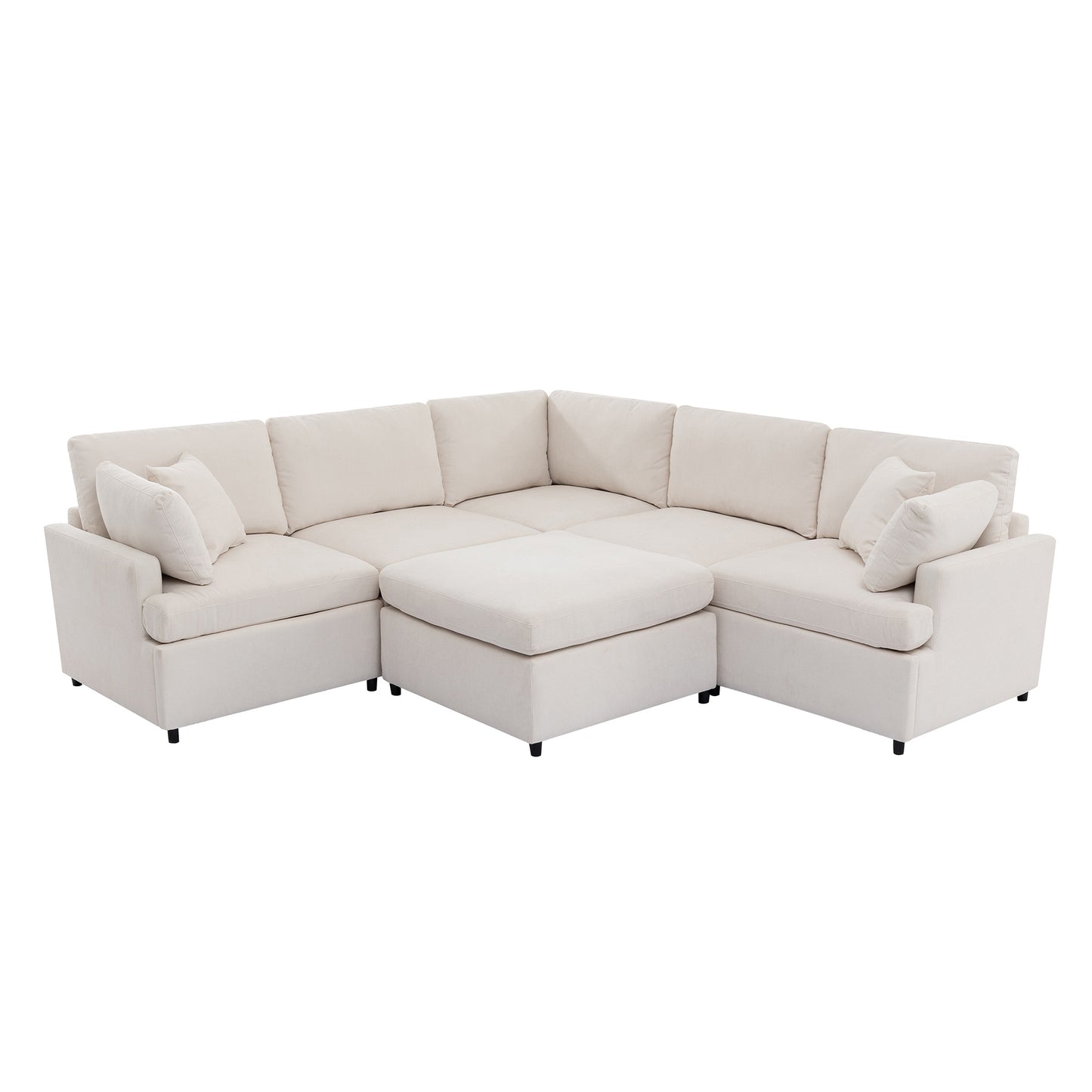 Upholstered beige sectional sofa with an ottoman and throw pillows