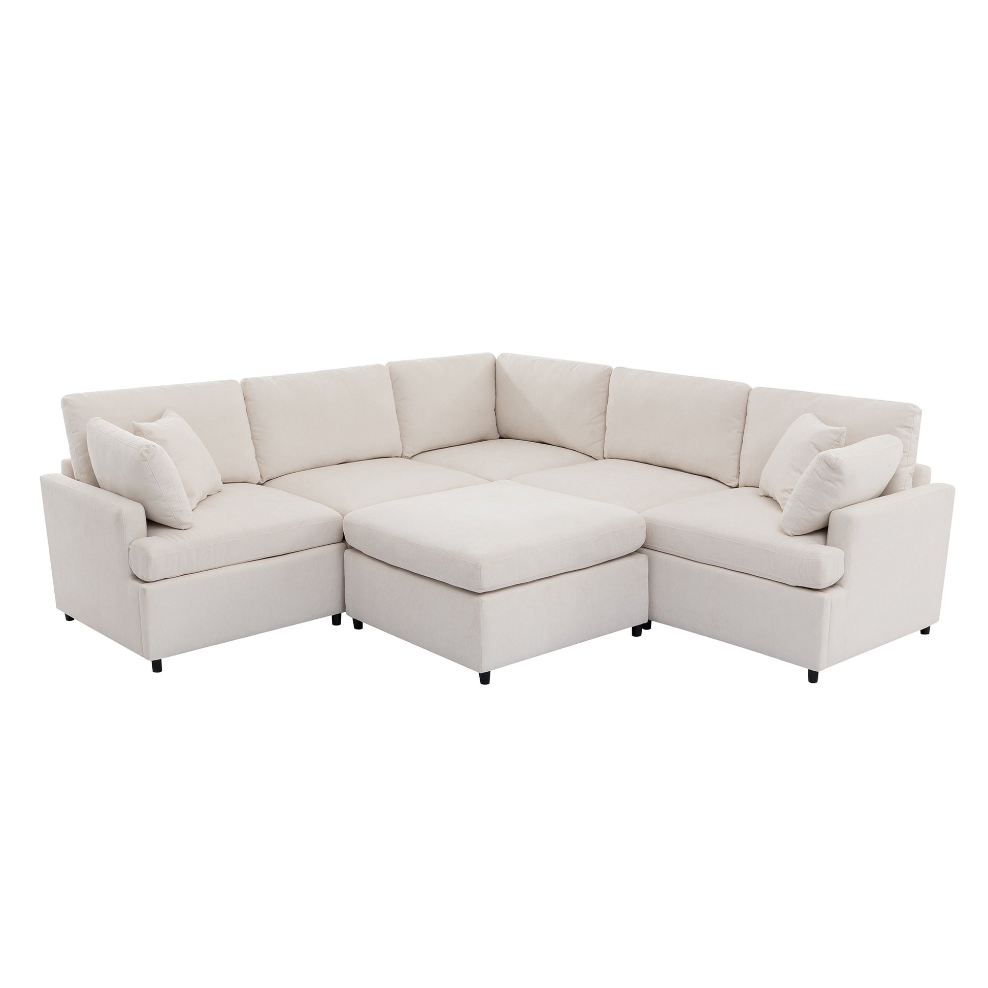 Upholstered beige sectional sofa with an ottoman and throw pillows