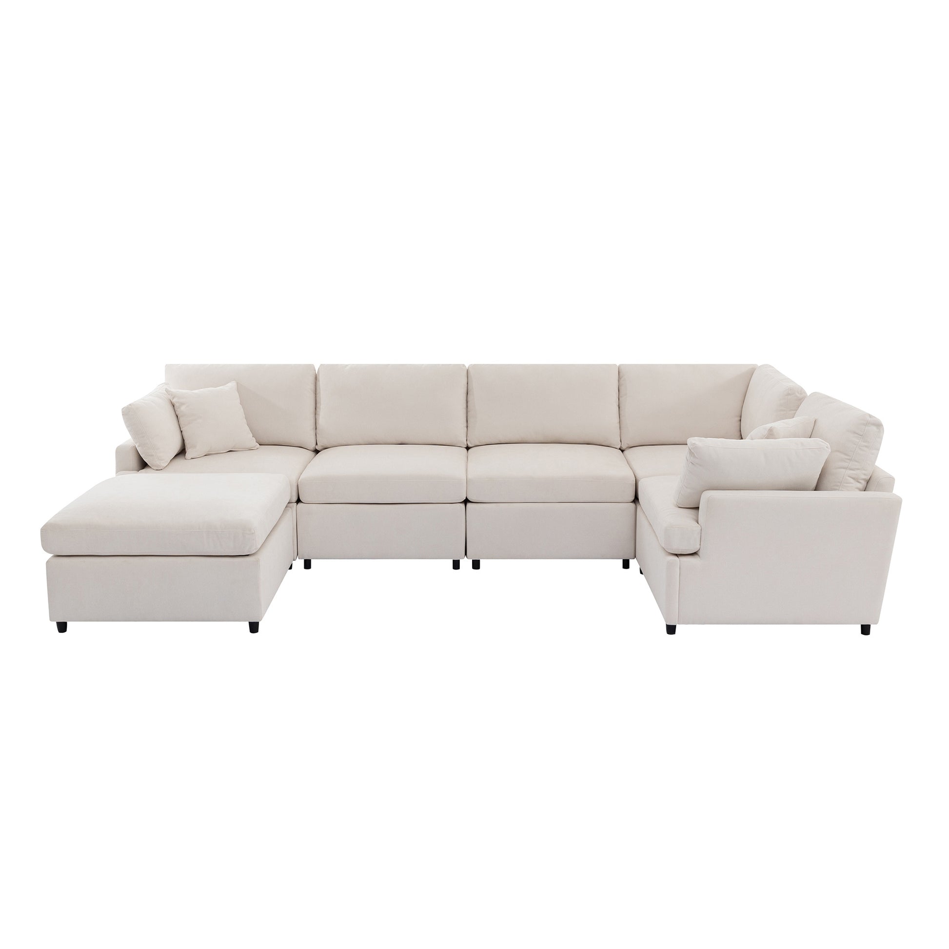 Modular cream fabric sectional sofa with chaise and accent pillows for a spacious living room