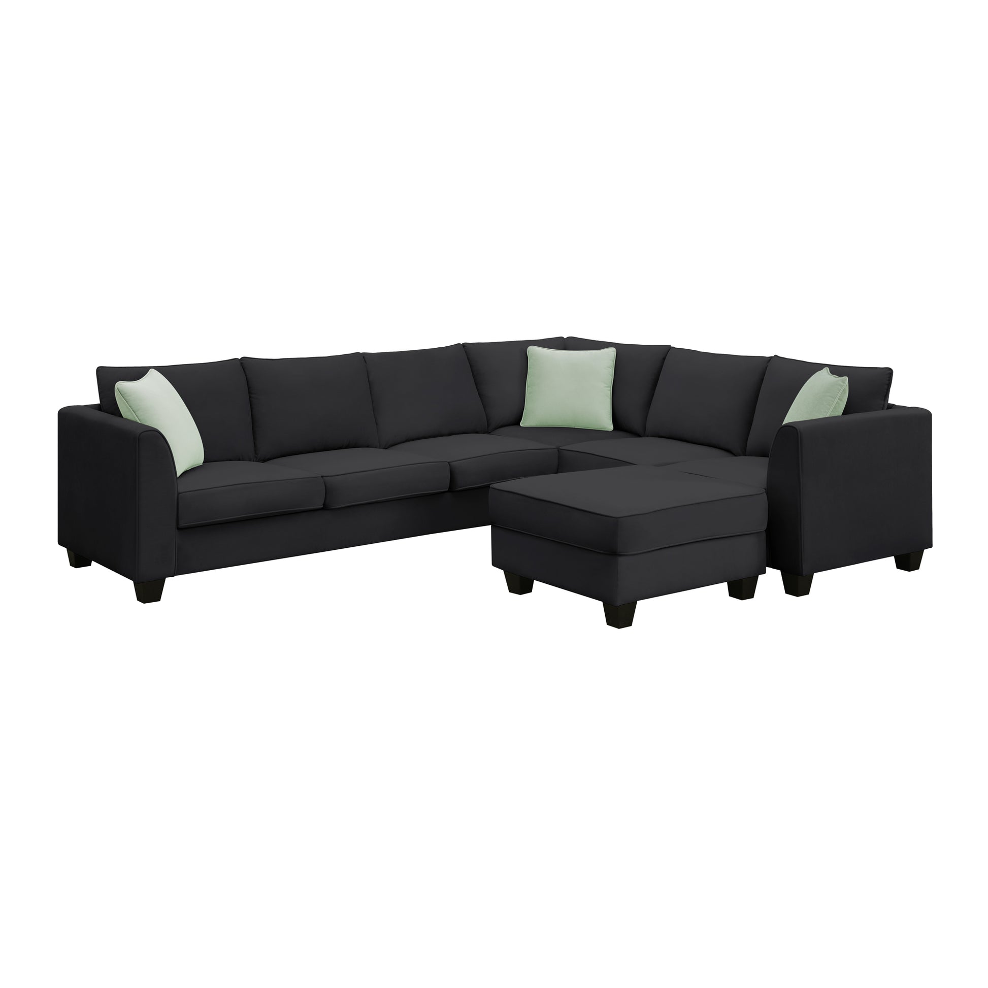 Dark grey sectional sofa with light green accent pillows and matching ottoman fabric upholstery