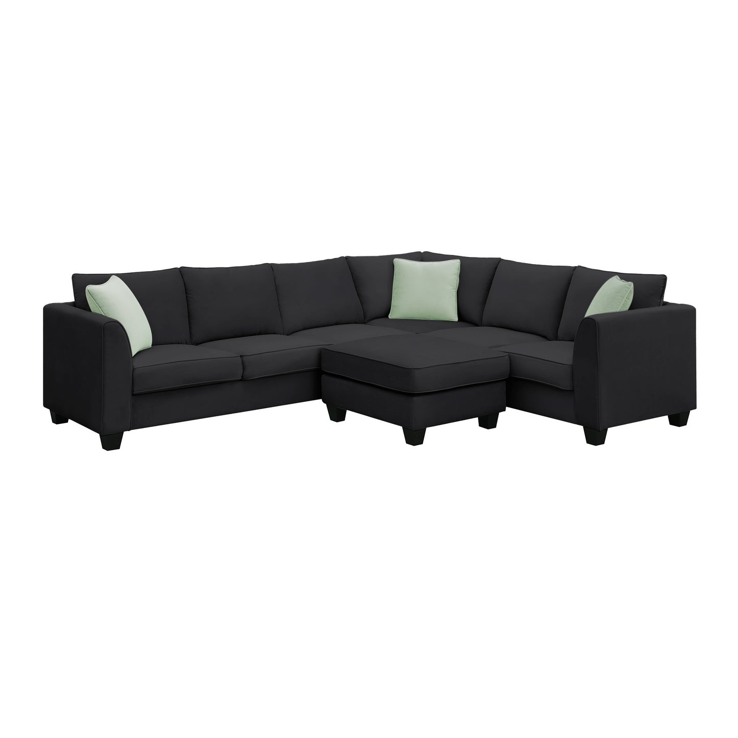 Dark gray fabric sectional sofa with three light green accent pillows and matching ottoman contemporary style