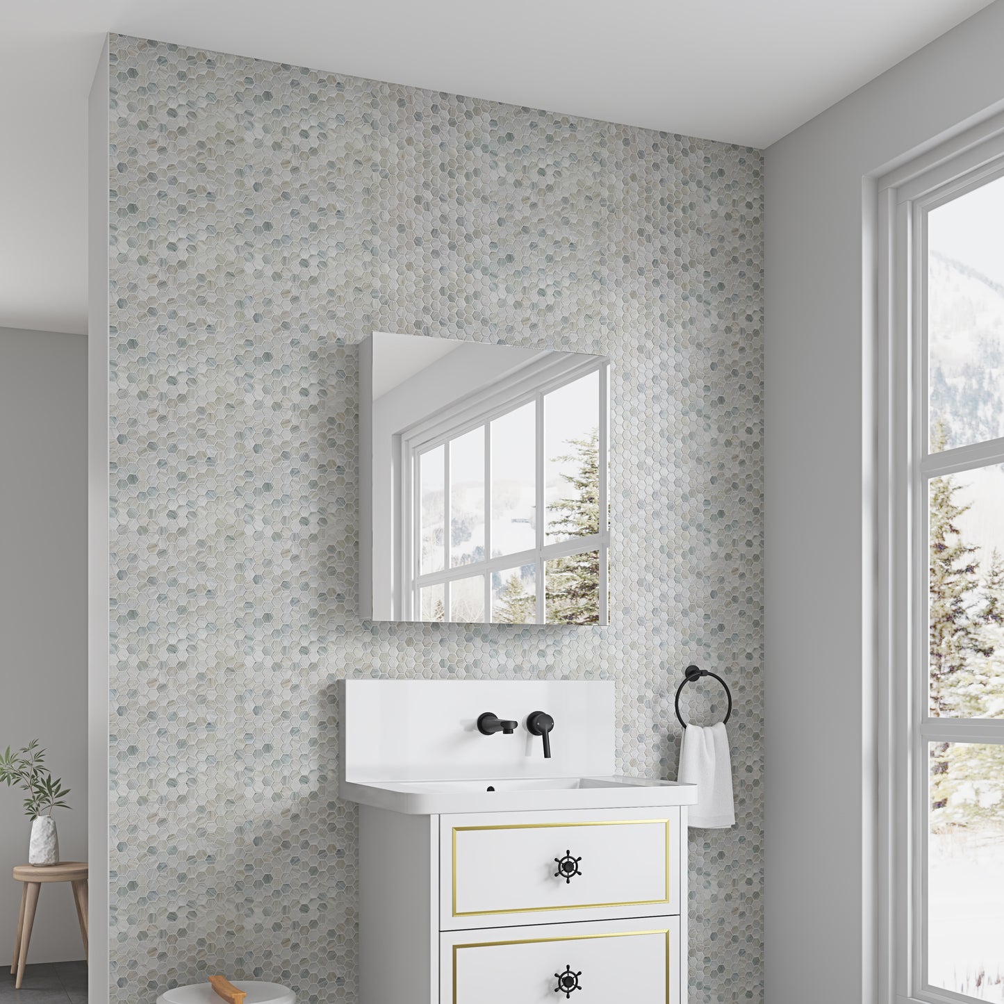 Hexagonal mosaic bathroom tiles in soft blues and greys for a serene ambiance