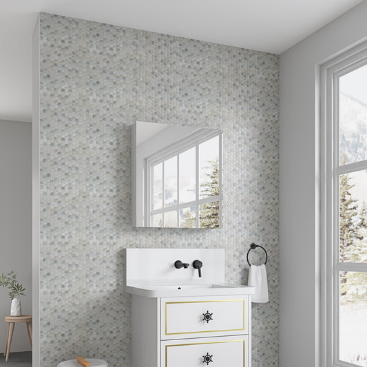 Hexagonal mosaic bathroom tiles in soft blues and greys for a serene ambiance