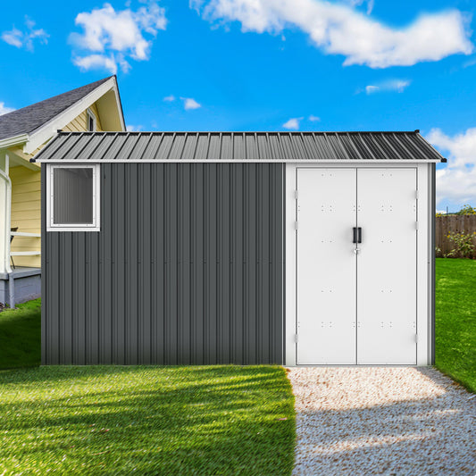 Gray metal storage shed with dual white doors and a window