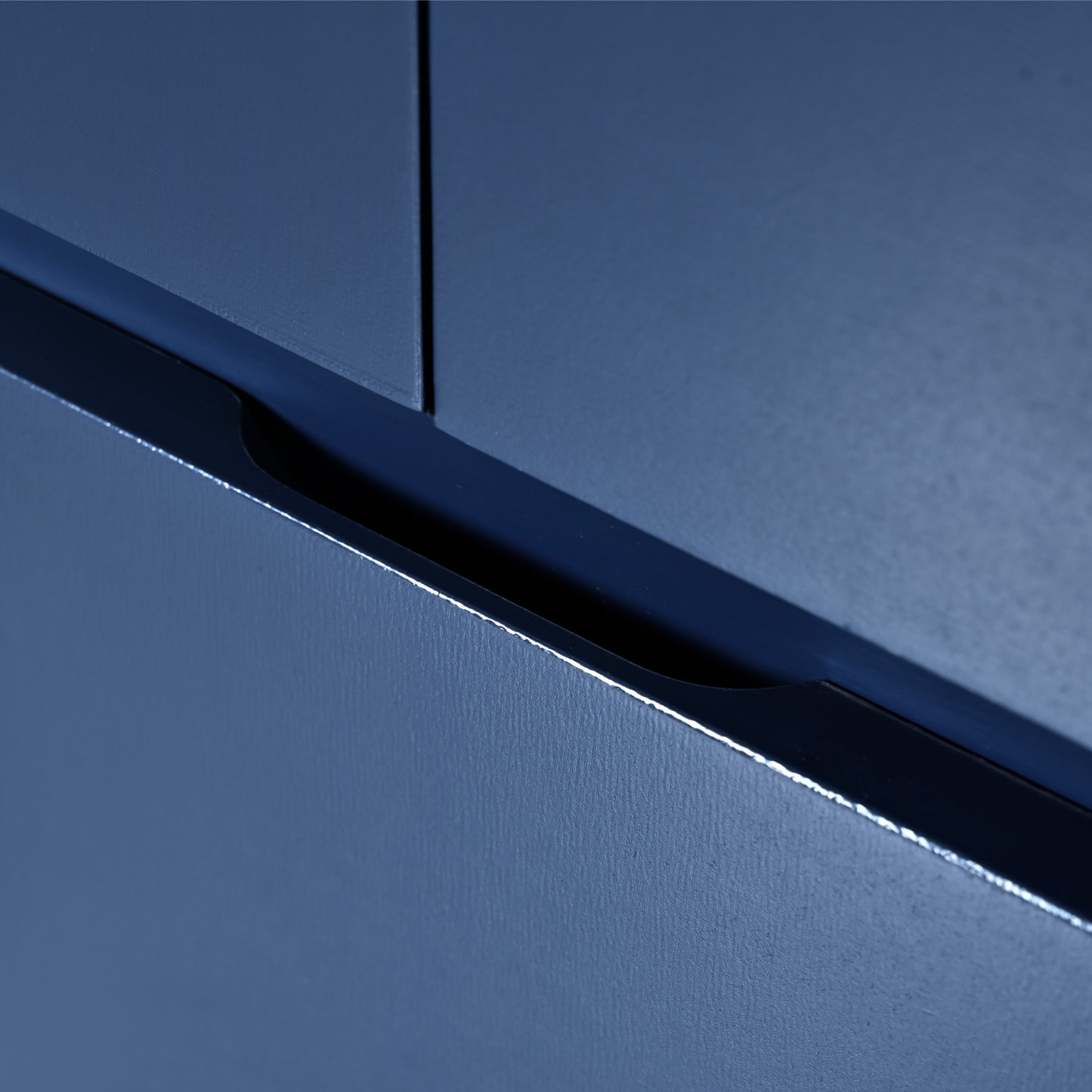Dark blue integrated cabinet handle detail