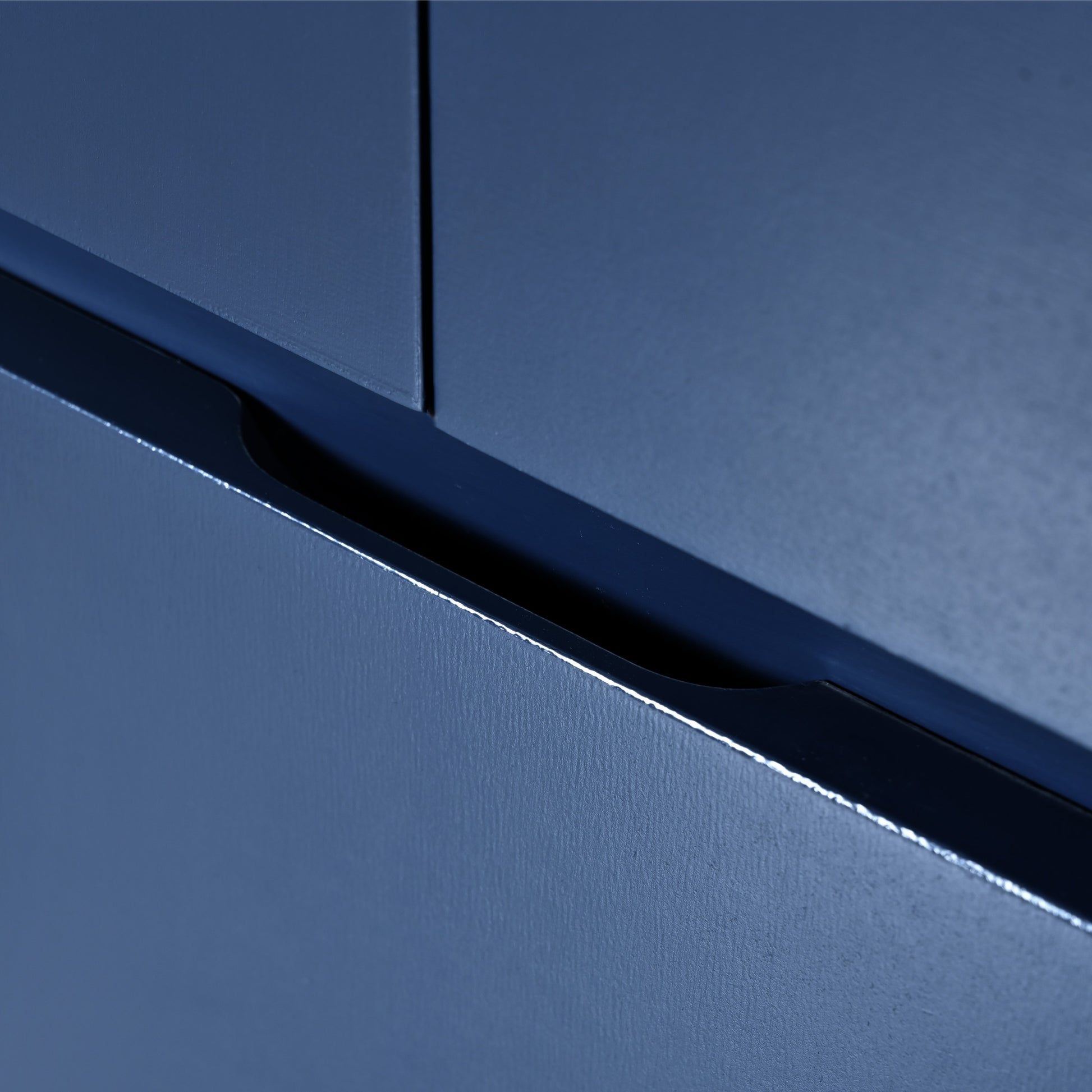 Dark blue integrated cabinet handle detail