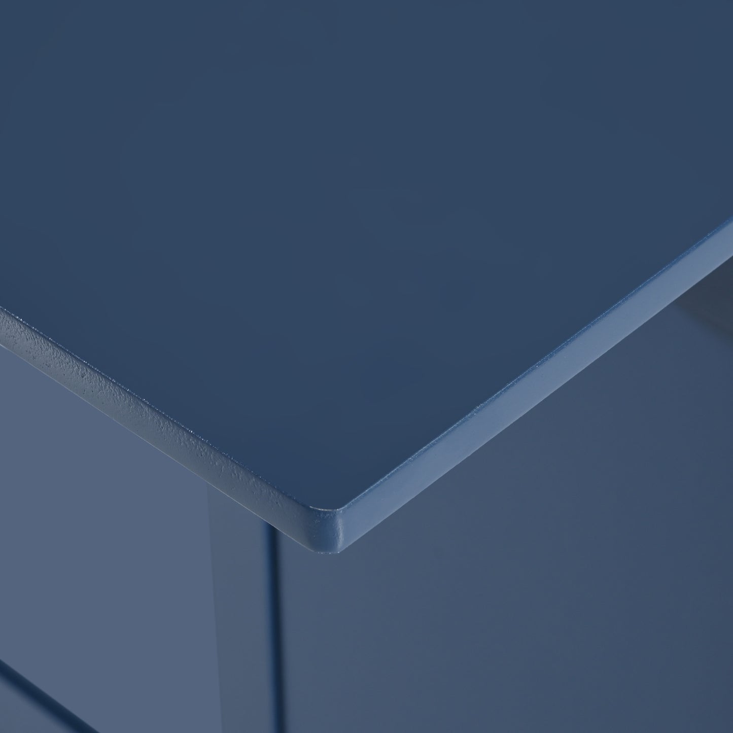 Closeup of a navy blue wooden end table corner