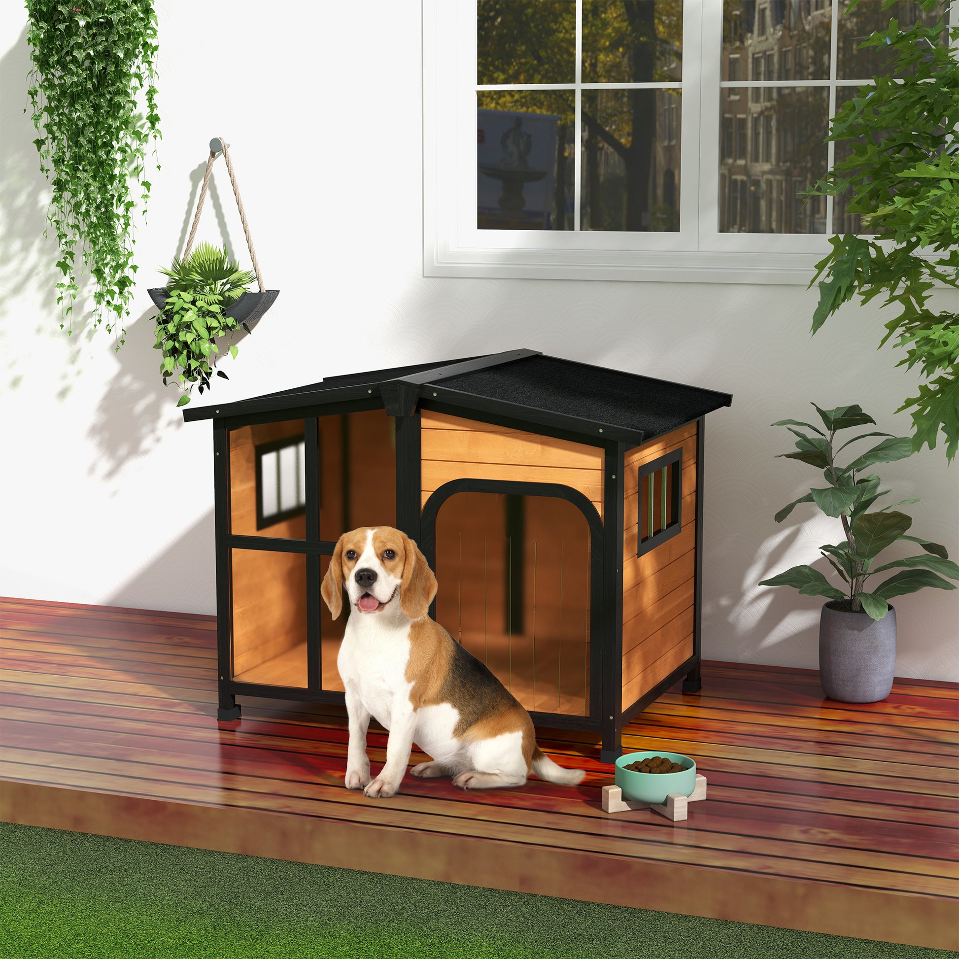 Wooden dog house with black trim and a beagle dog sitting outside