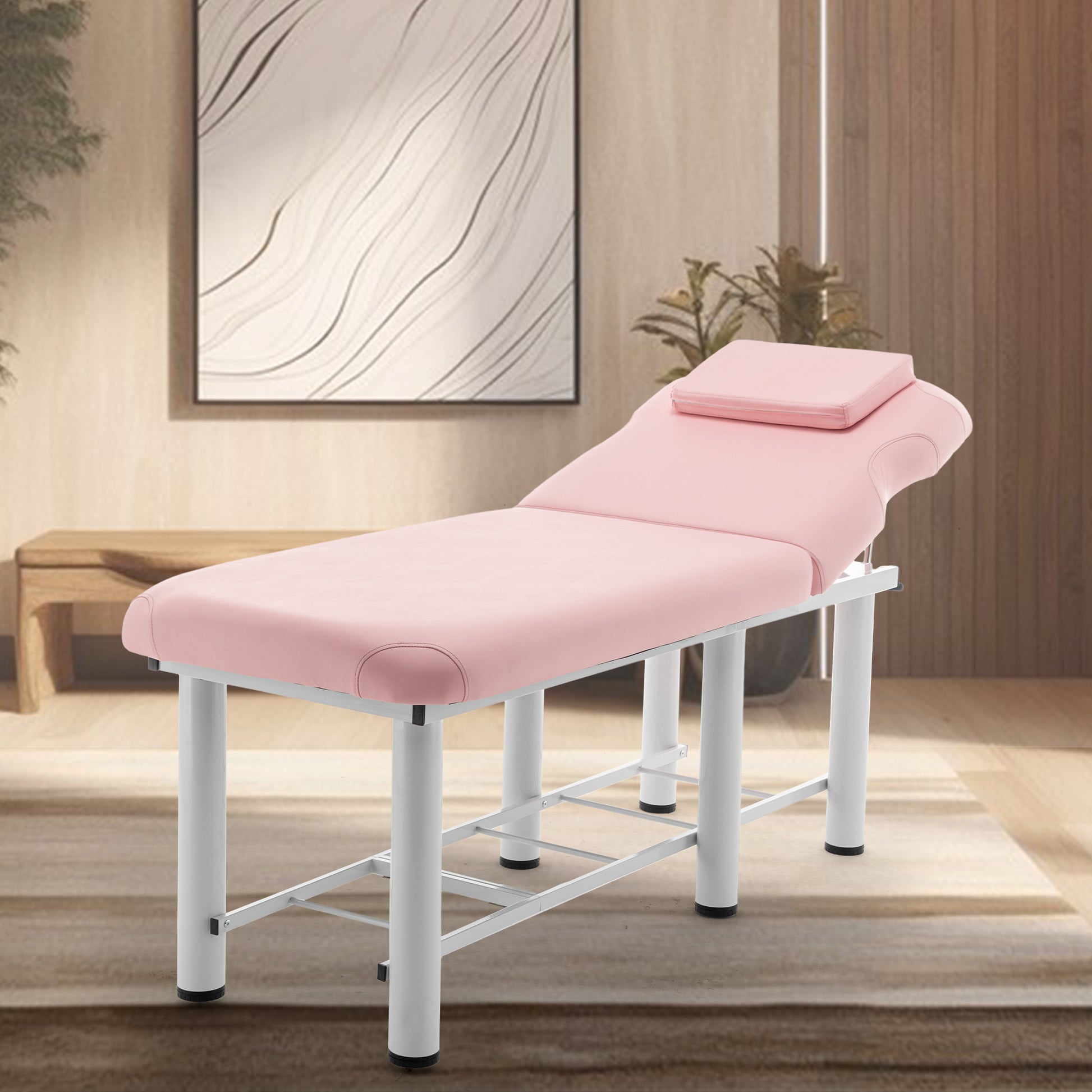 Pink upholstered spa bed with adjustable headrest and white metal frame perfect for massage therapy