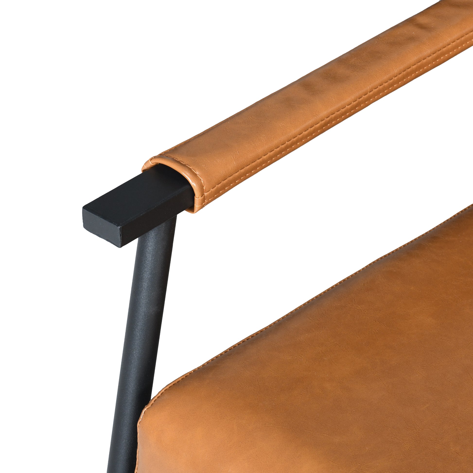 Closeup of brown faux leather armrest with visible stitching on a black metal frame chair