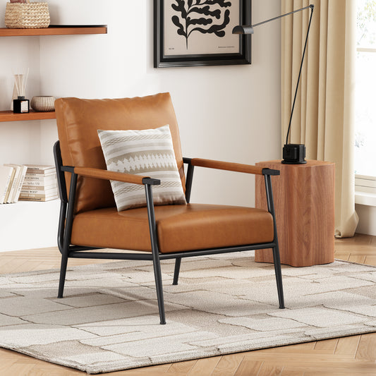 Tan faux leather accent chair with black metal frame and striped throw pillow