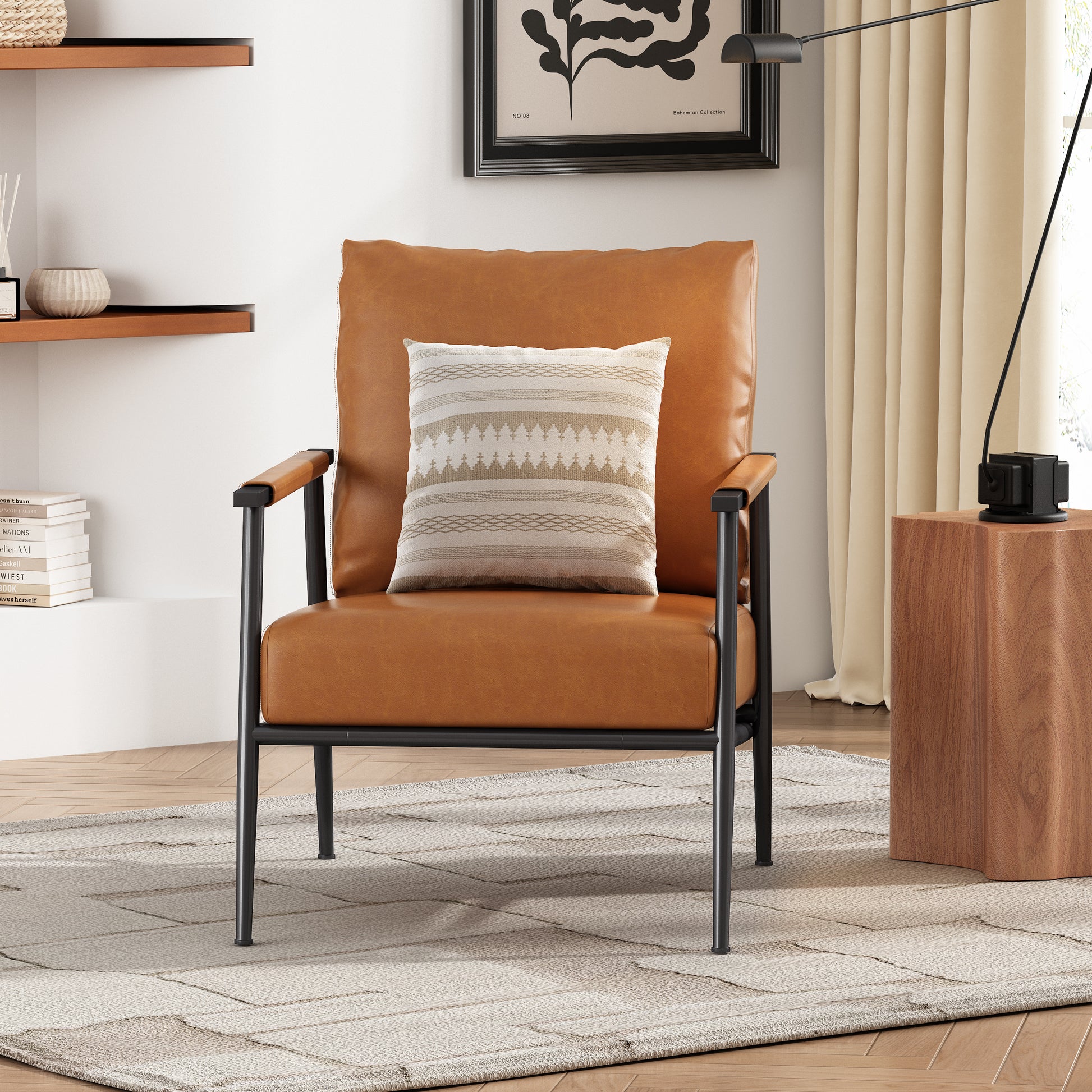 Midcentury modern armchair with tan leather upholstery and black metal frame