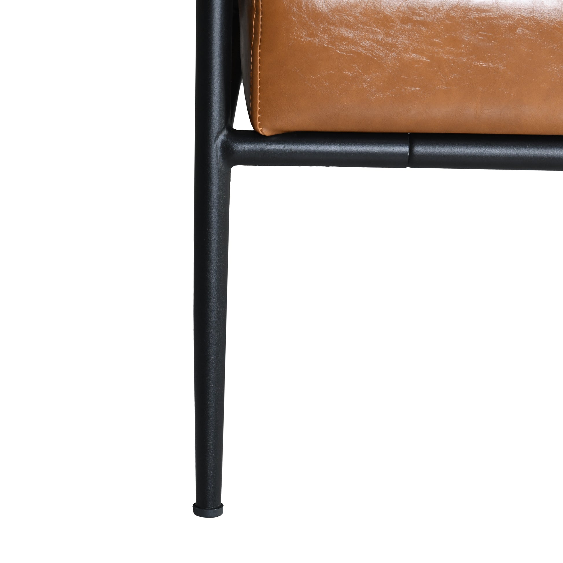 Tan leather accent chair seat with black metal legs