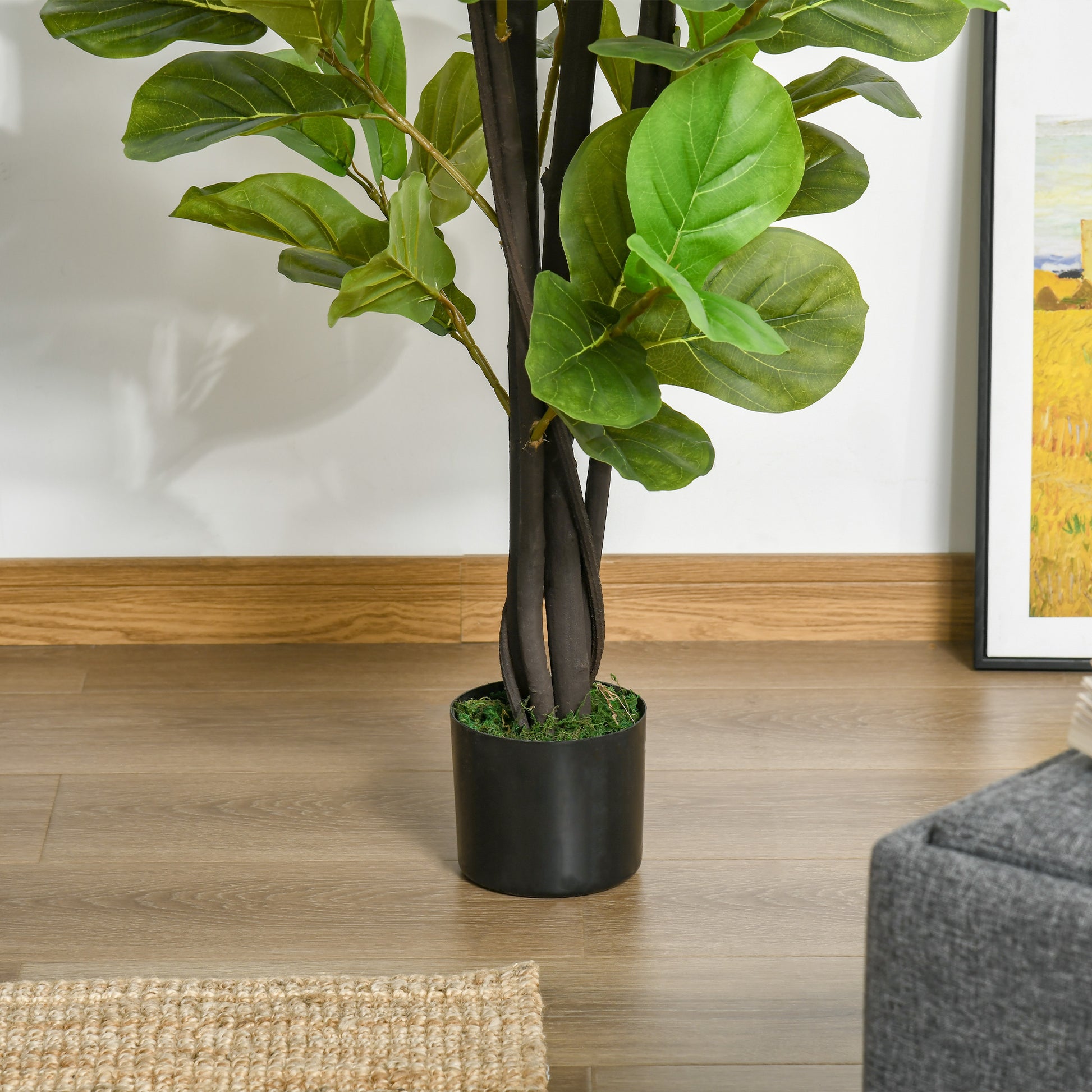Realistic faux fiddle leaf fig plant with dark brown trunk and lush green leaves in a black planter