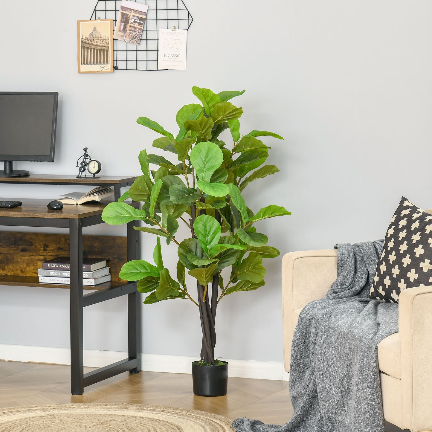 Realistic artificial fiddle leaf fig plant with large green leaves and dark brown trunk in black pot