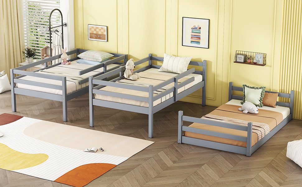 Gray wooden toddler bed with rails and stuffed animals